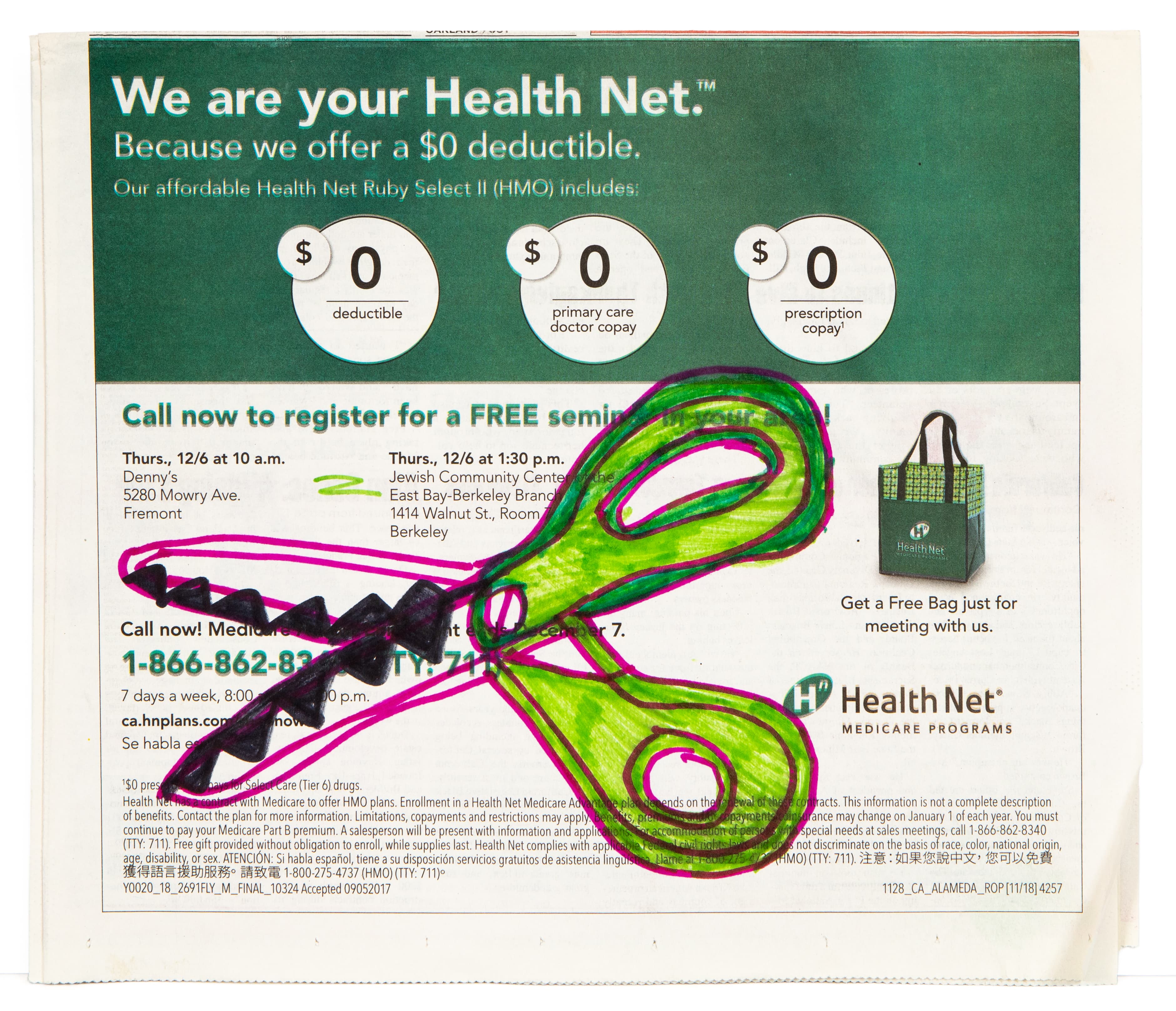 Drawing in pink and green ink over a health insurance advertisement, featuring flowing organic shapes