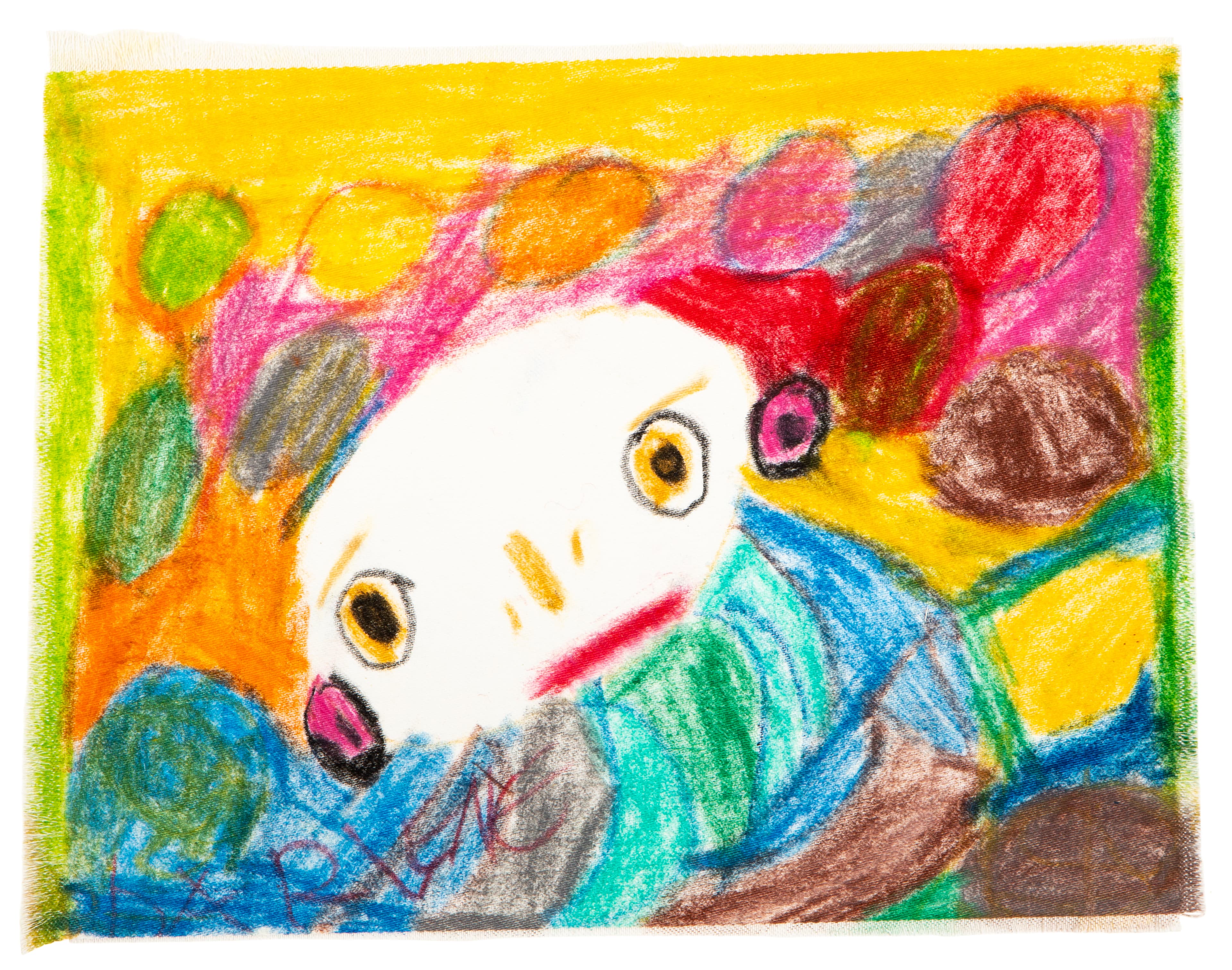 Colorful crayon drawing on textile showing a white face with yellow eyes surrounded by vibrant abstract shapes