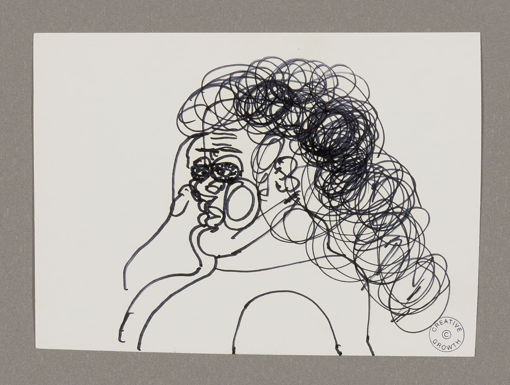 Ink drawing of a person with curly hair in profile, rendered in continuous black line on white paper