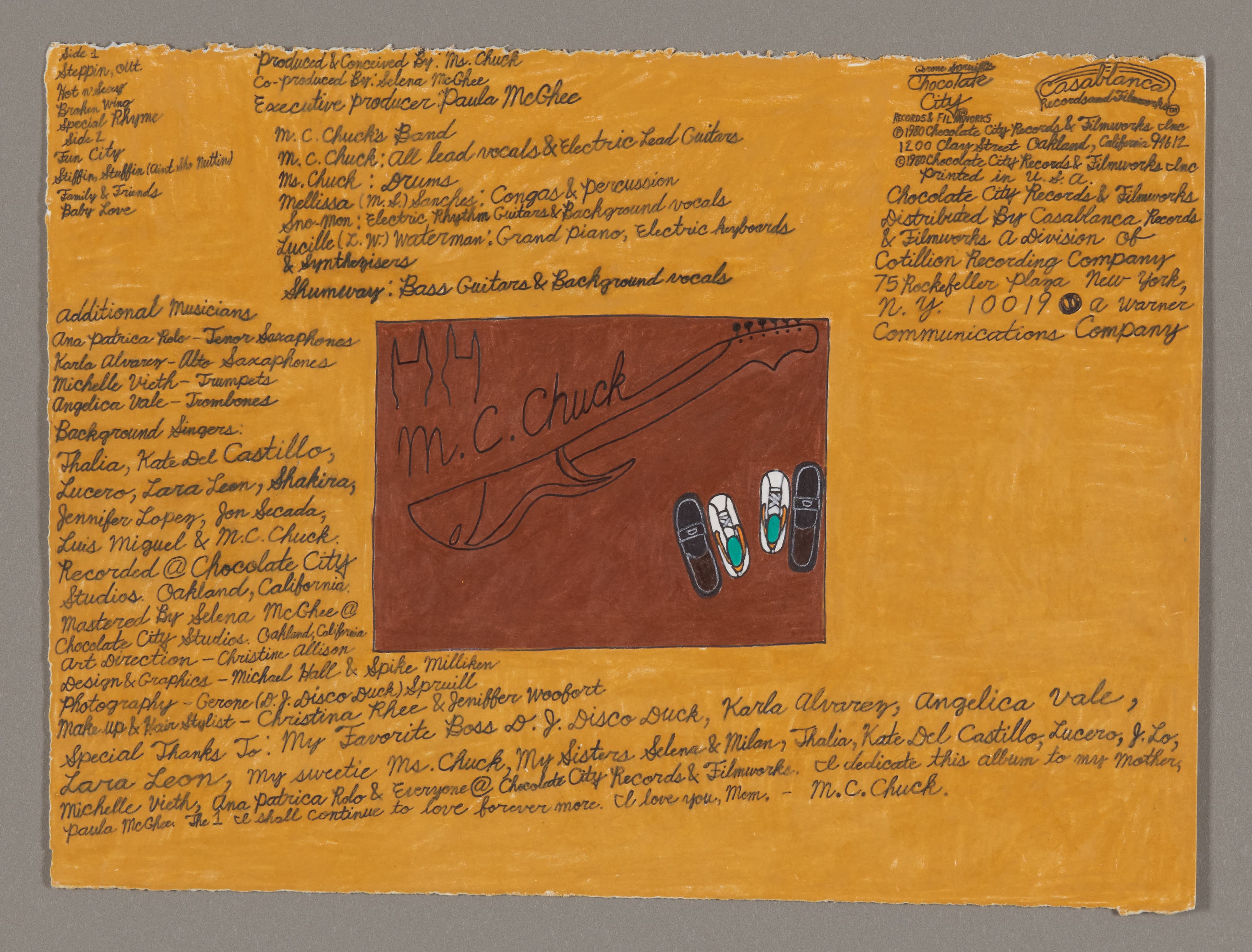 Mixed media drawing on orange paper with handwritten text surrounding a central brown rectangle containing a signature and small objects