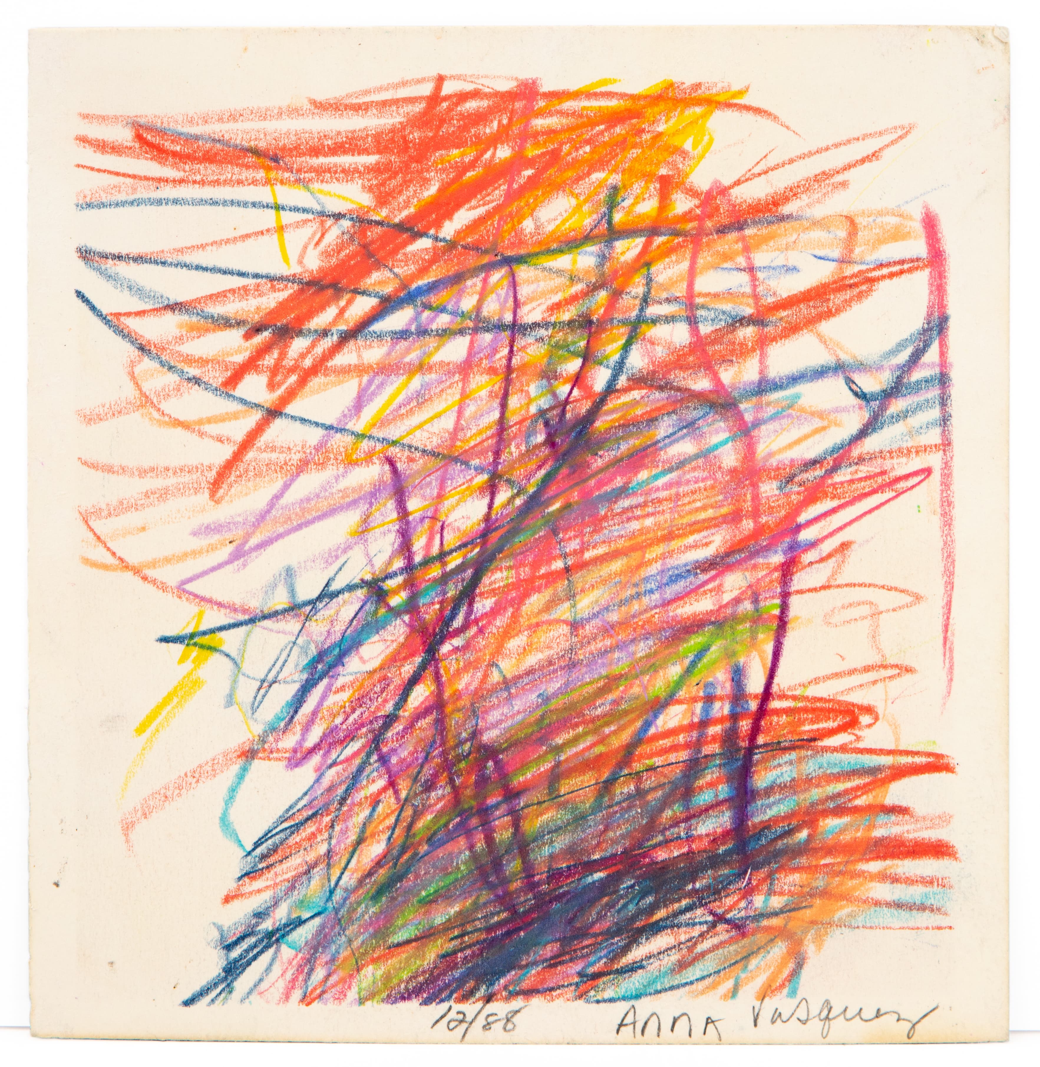 Abstract drawing with energetic colored pencil scribbles in red, orange, yellow, purple, and blue on cream paper
