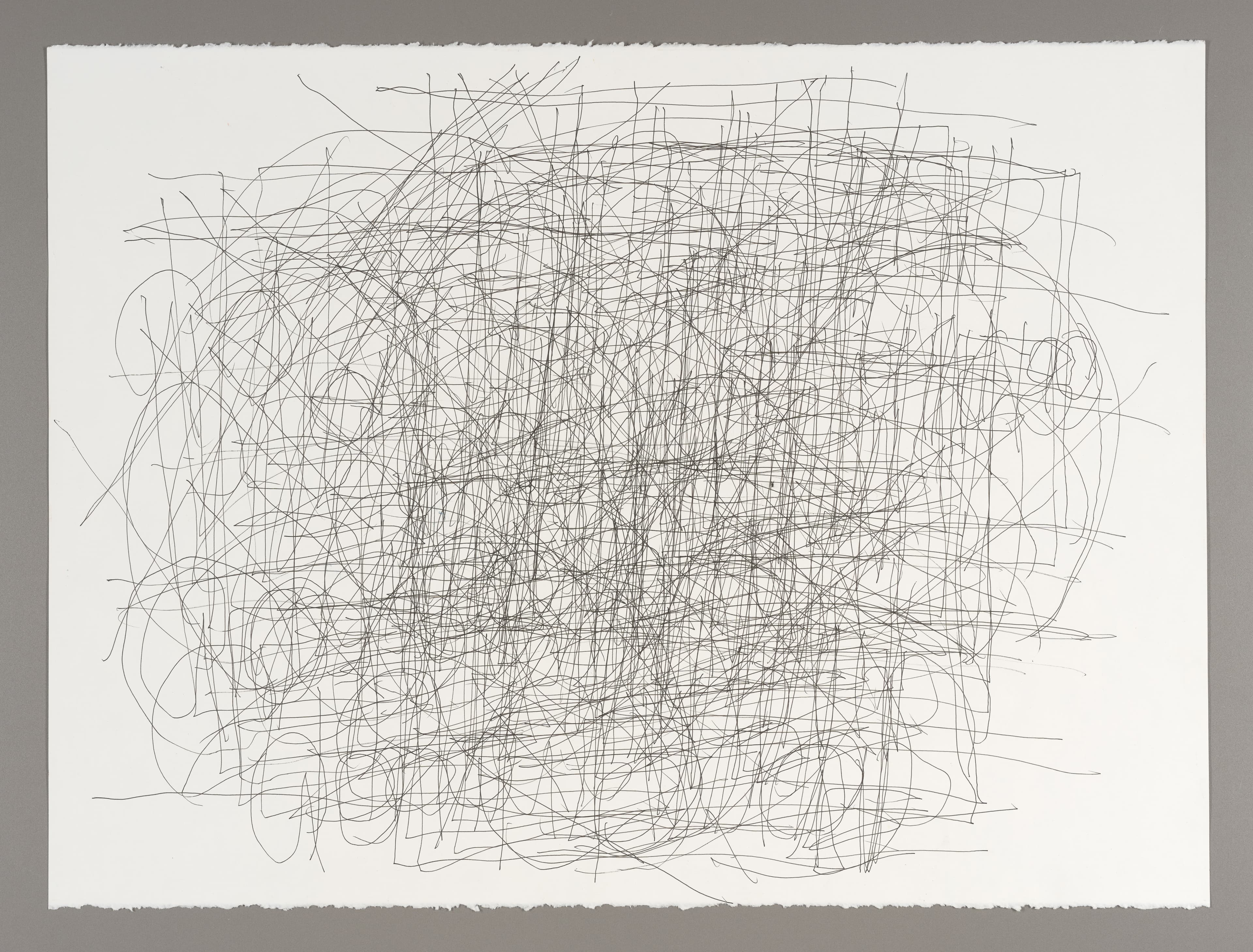 Abstract drawing with dense network of intersecting curved and straight lines in gel pen on white paper