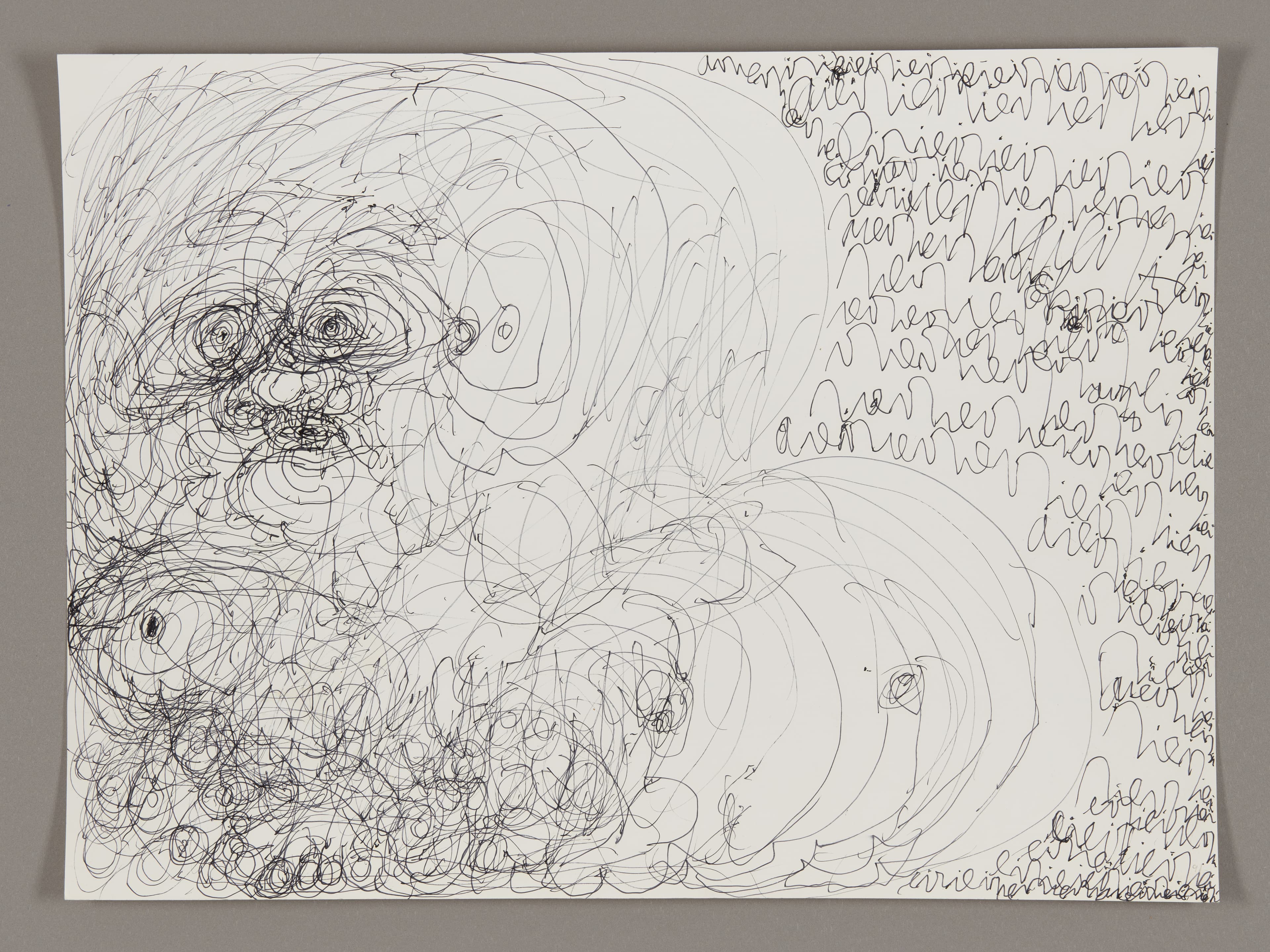 Ink drawing with dense circular scribbles on left side and handwritten text covering right side on white paper