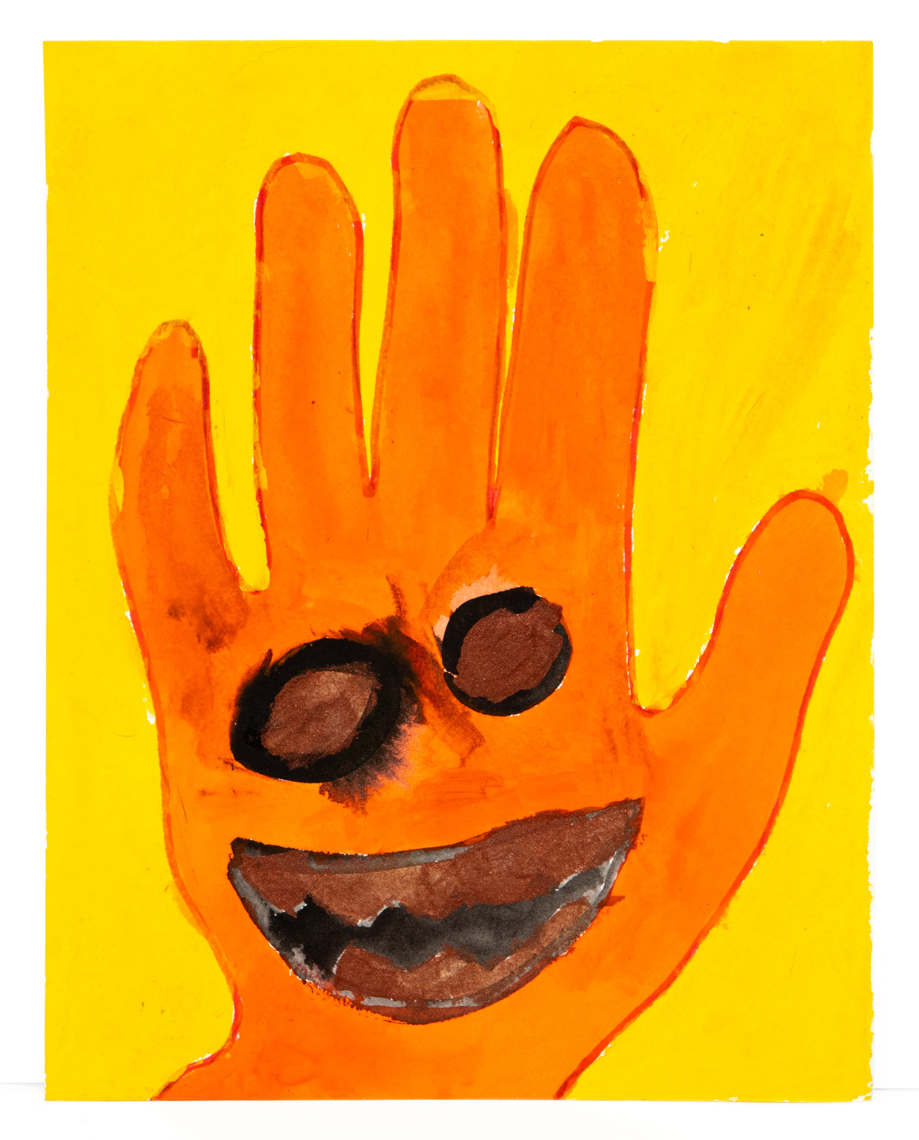 Watercolor painting of orange handprint with smiling face on yellow background