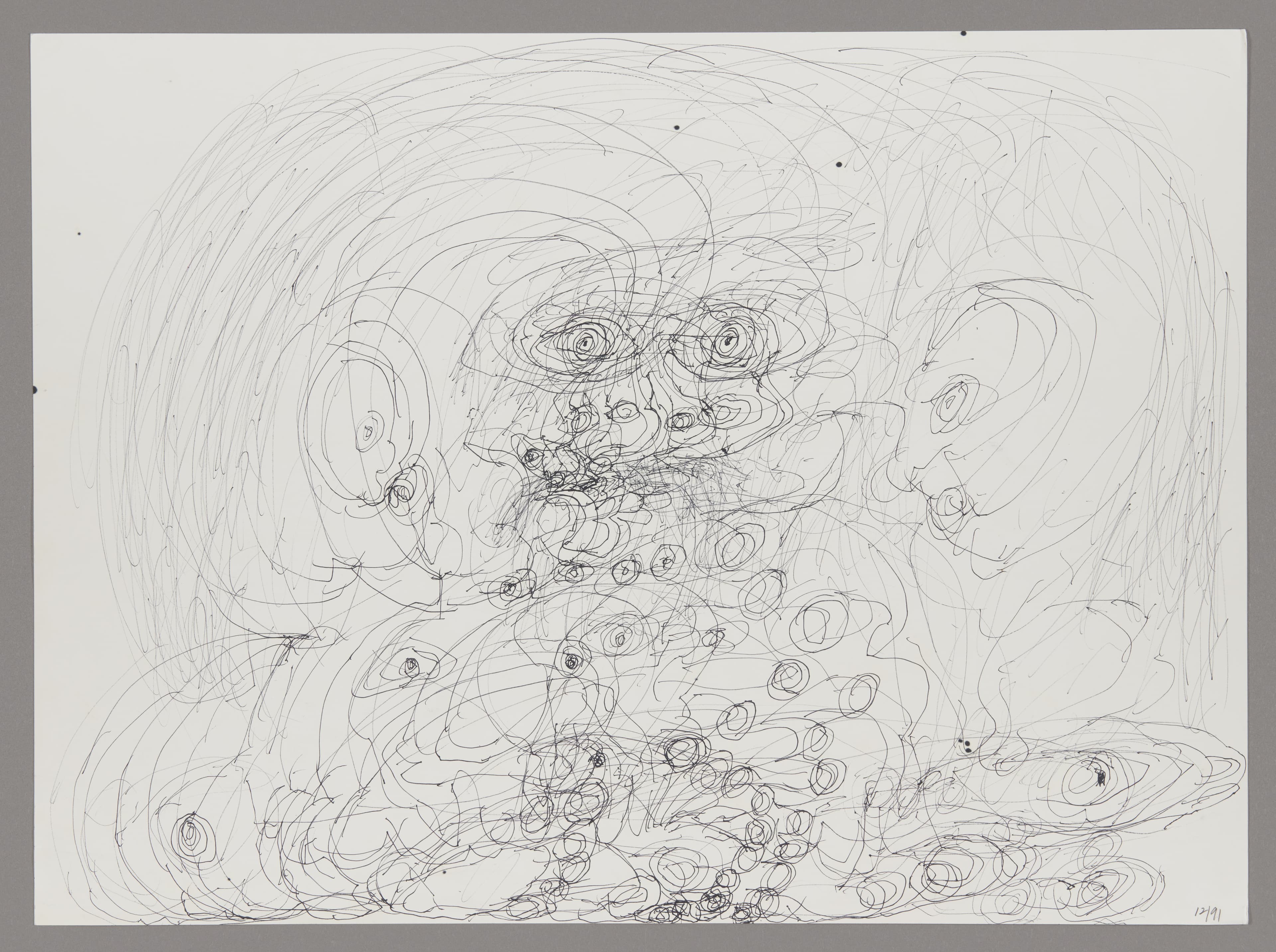 Ink drawing showing abstract facial features with swirling lines and circular patterns on white paper