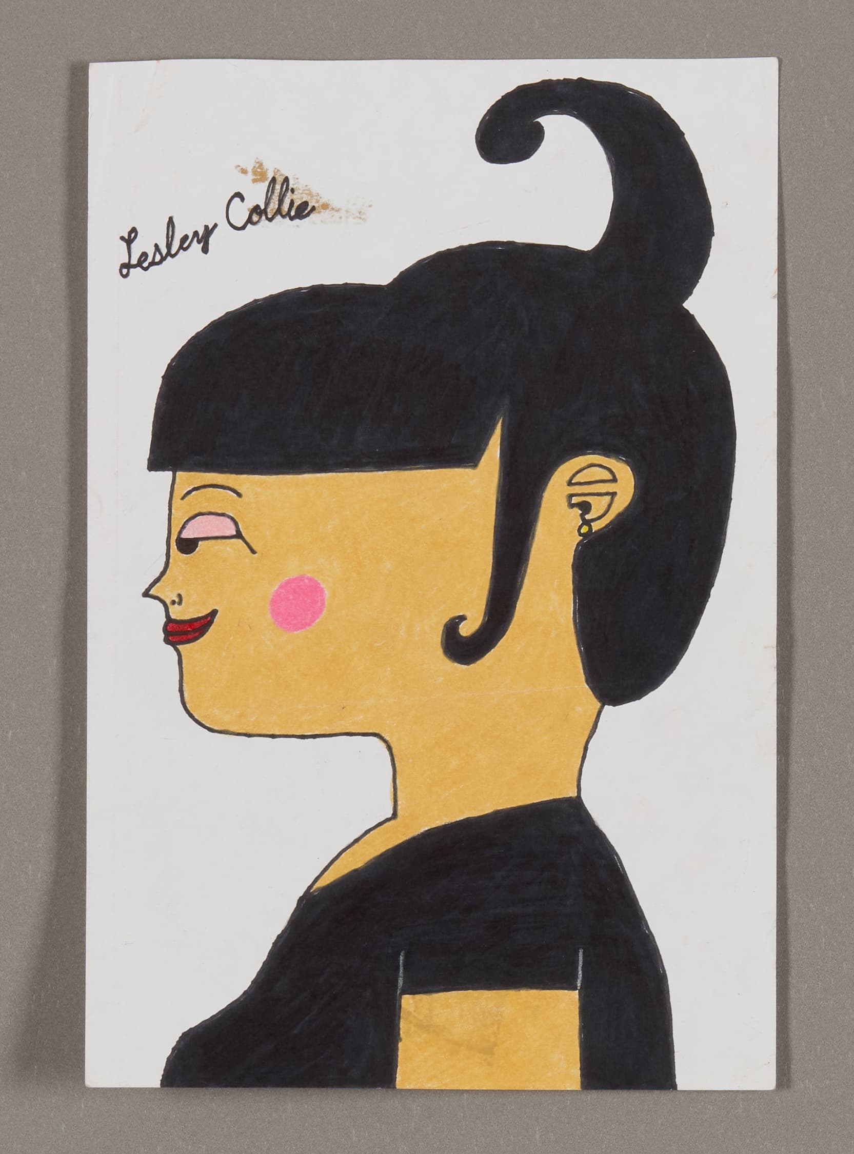 Portrait drawing of a person in profile with black hair in a bun, yellow skin, pink cheek, and black clothing on white paper