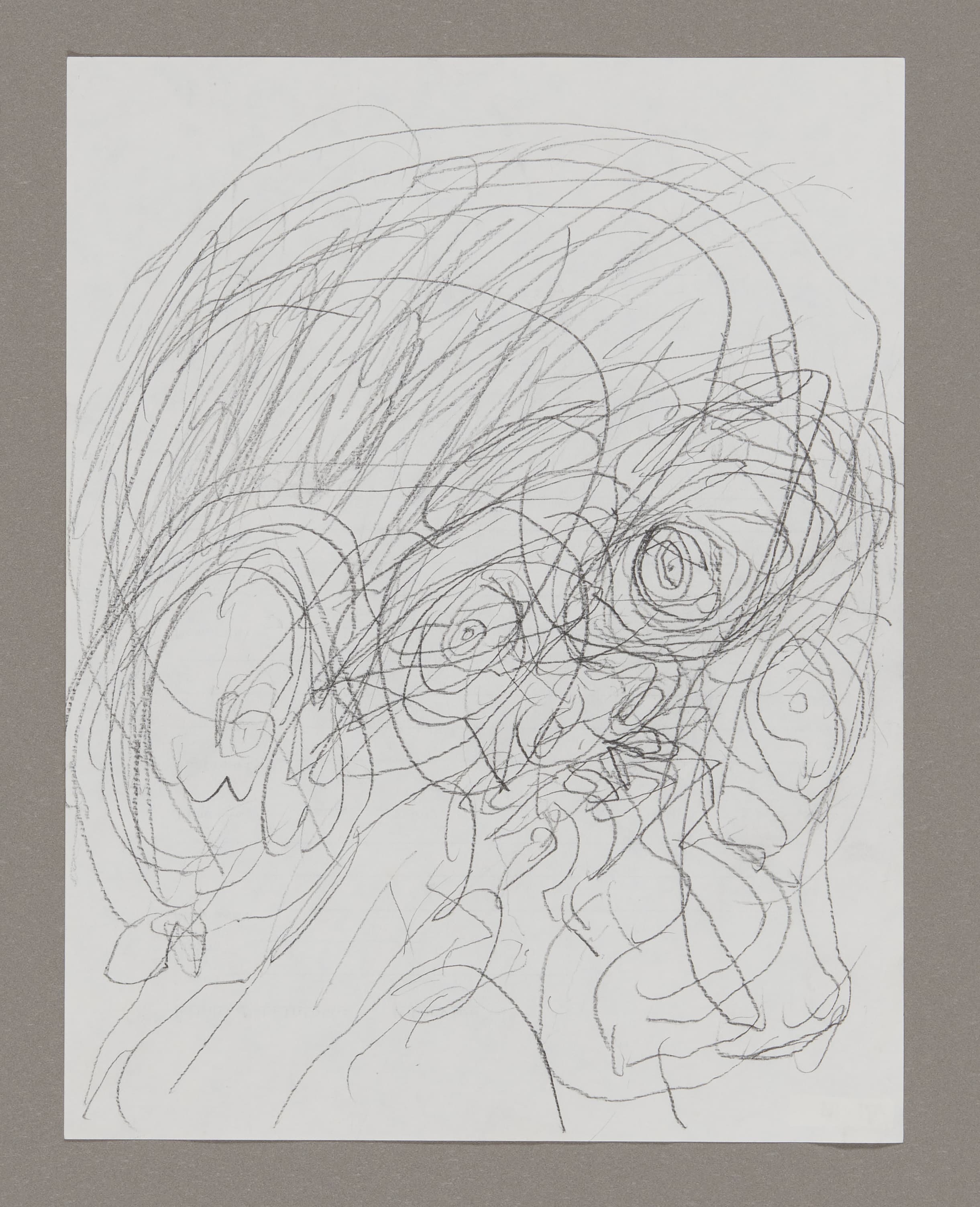 Graphite drawing on white paper showing overlapping circular and linear forms with energetic scribbled lines