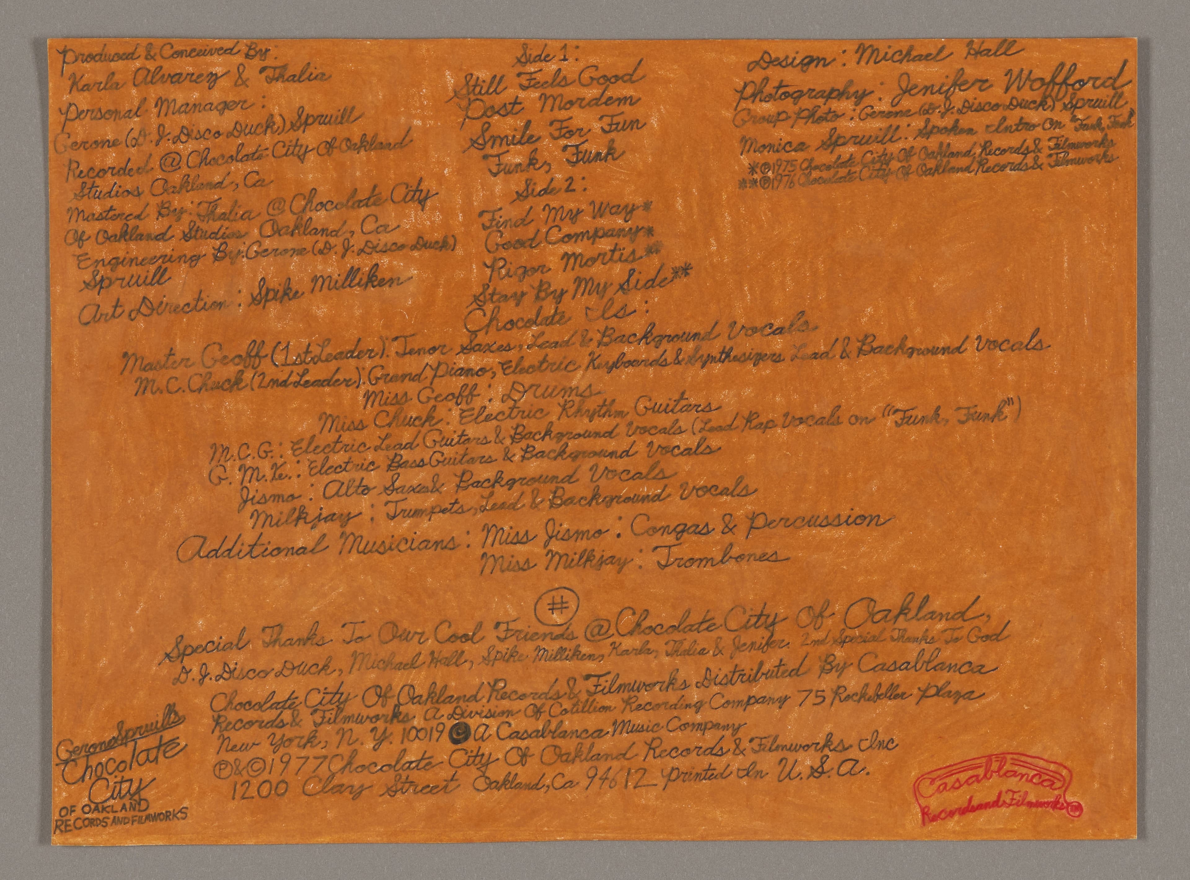 Handwritten text in brown ink on orange paper, resembling album liner notes with credits and information