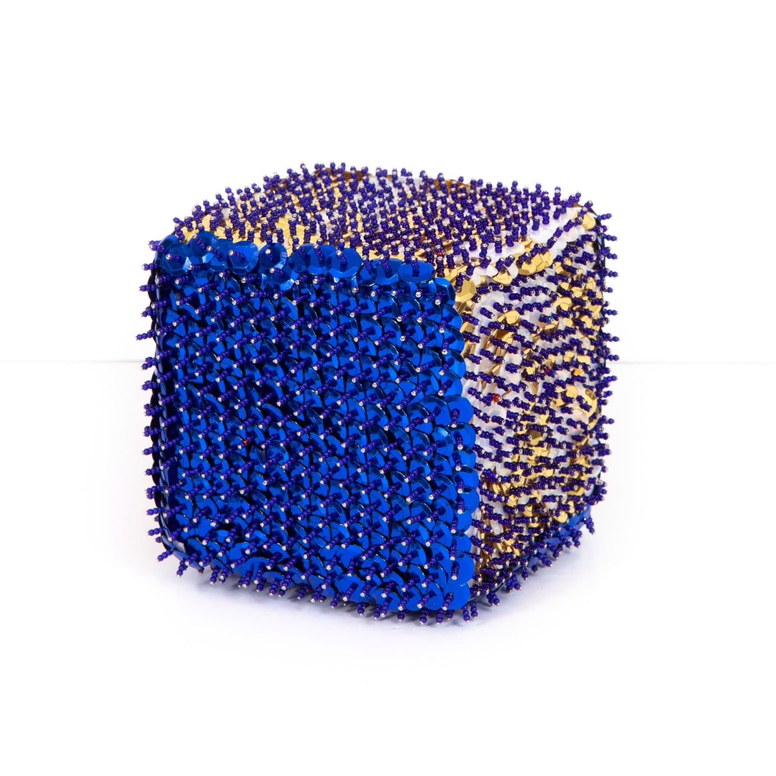 Cubic sculpture covered in blue sequins and pins with gold/yellow patterned areas on styrofoam base.