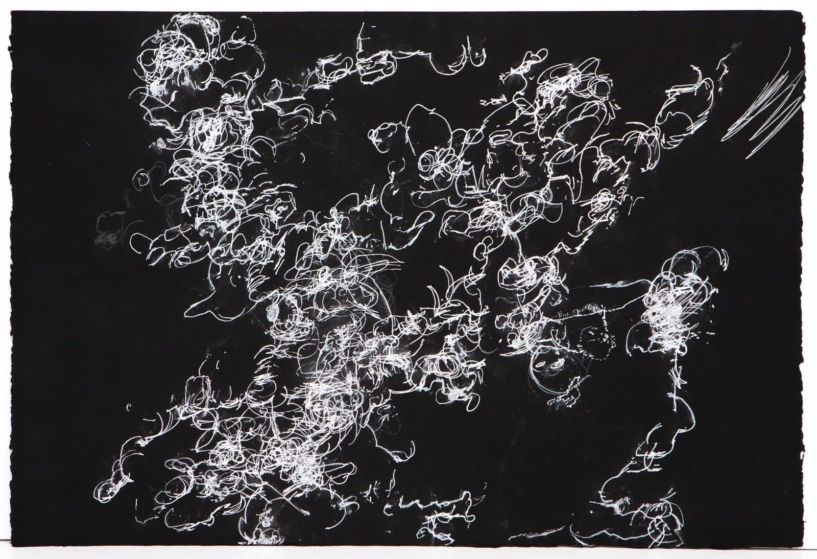 Abstract drawing in white ink on black paper with dense, energetic scribbled lines and circular forms across the surface.