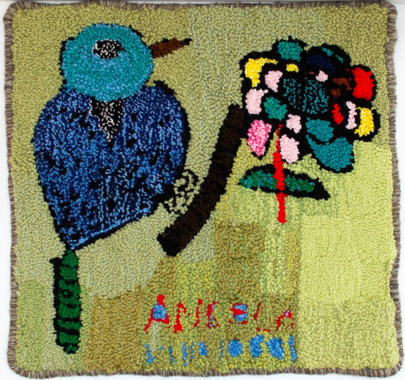 Hooked rug depicting a blue bird perched on a branch beside a multicolored flower on a yellow-green background.