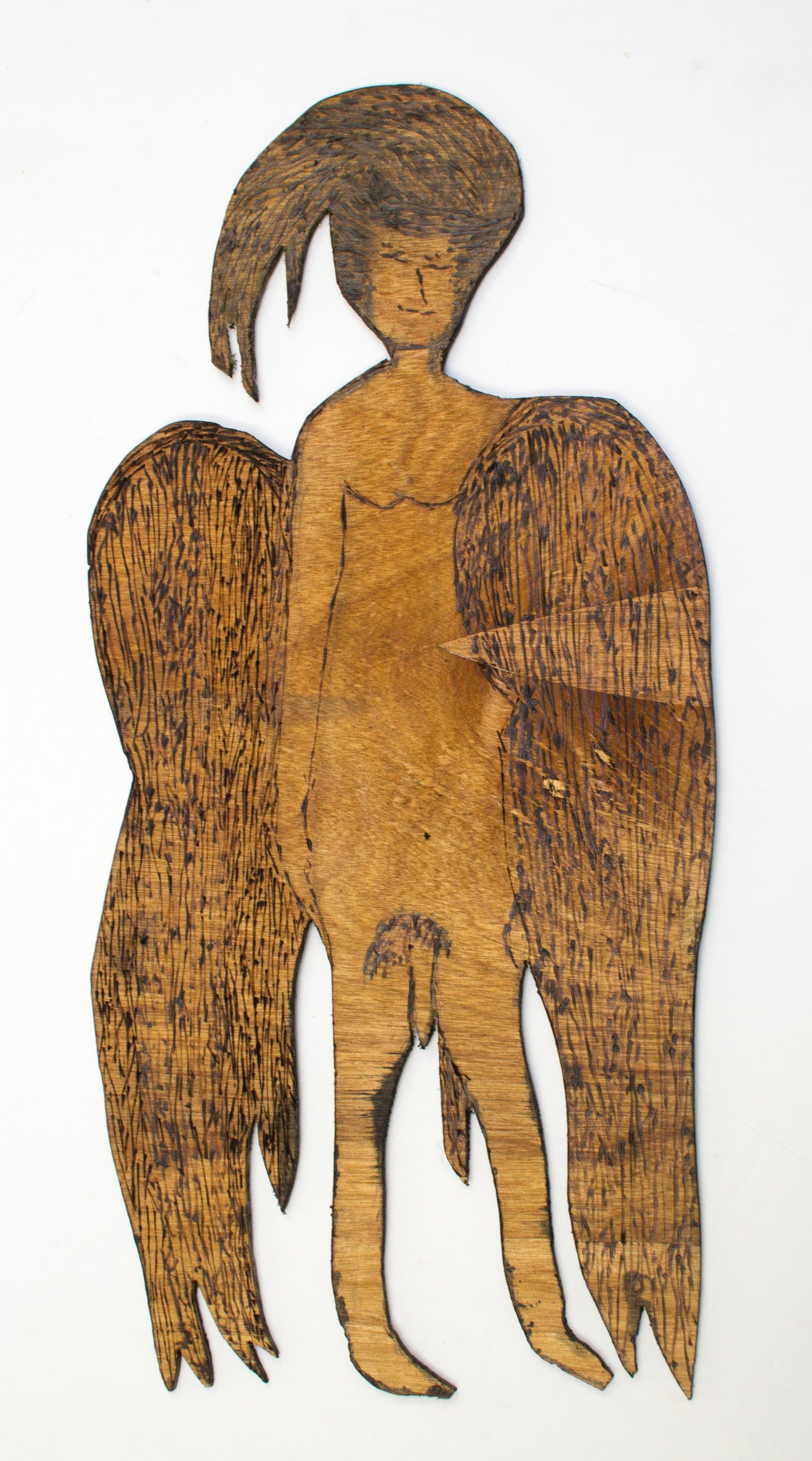 Cut and burned wood panel depicting a winged humanoid figure with flowing hair, in warm golden-brown tones.