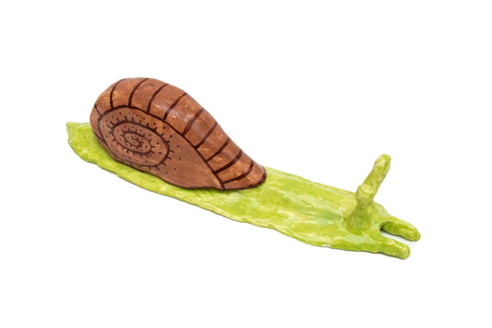 Ceramic sculpture of a snail with a brown painted shell featuring incised spiral and grid patterns on a bright green body.