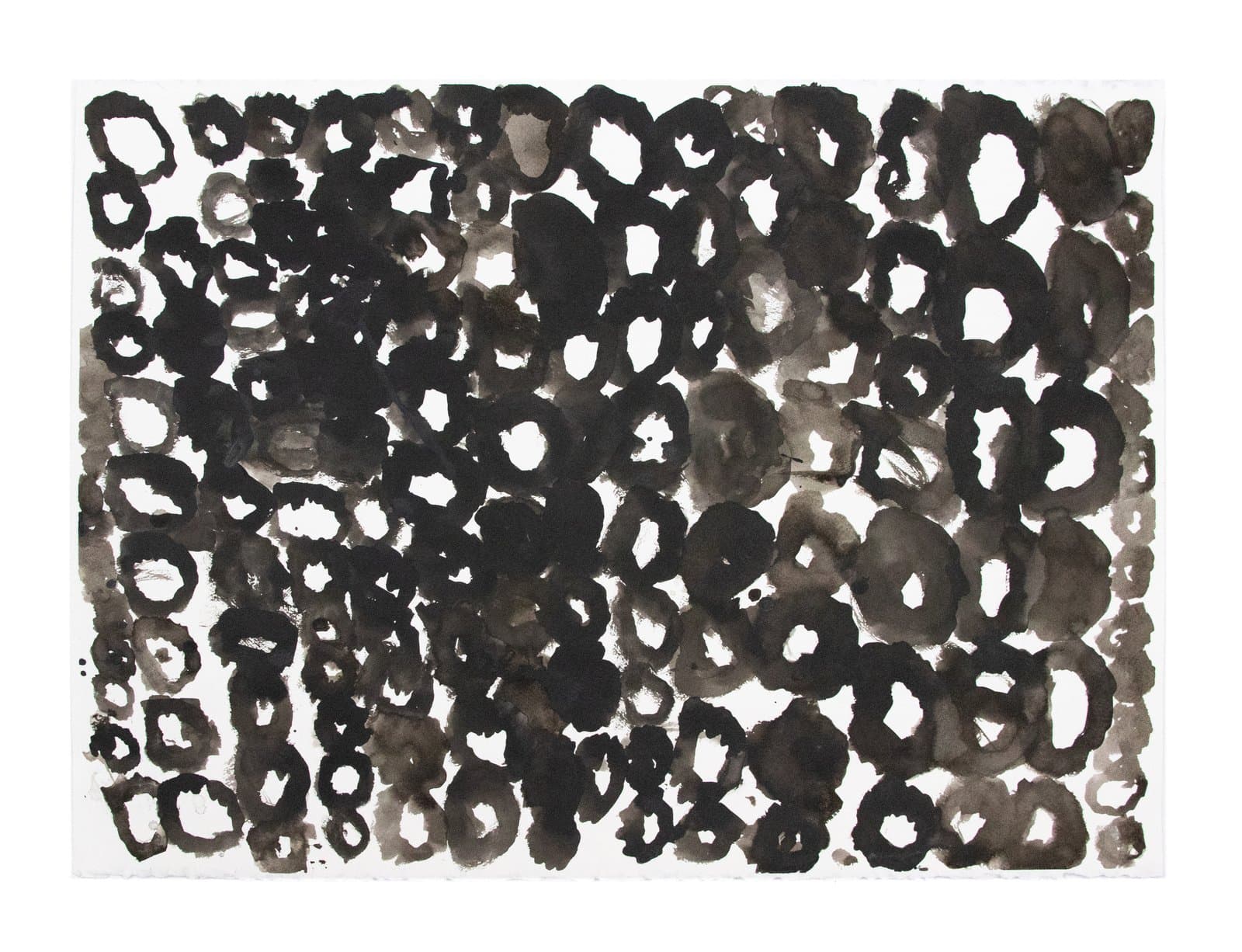 Abstract ink drawing densely filled with irregular oval and ring shapes in black and gray on white paper.