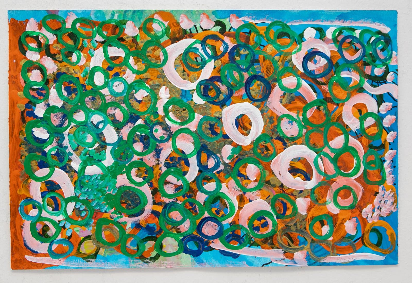 Abstract acrylic painting densely packed with overlapping rings in green, blue, and white on an orange and blue ground.