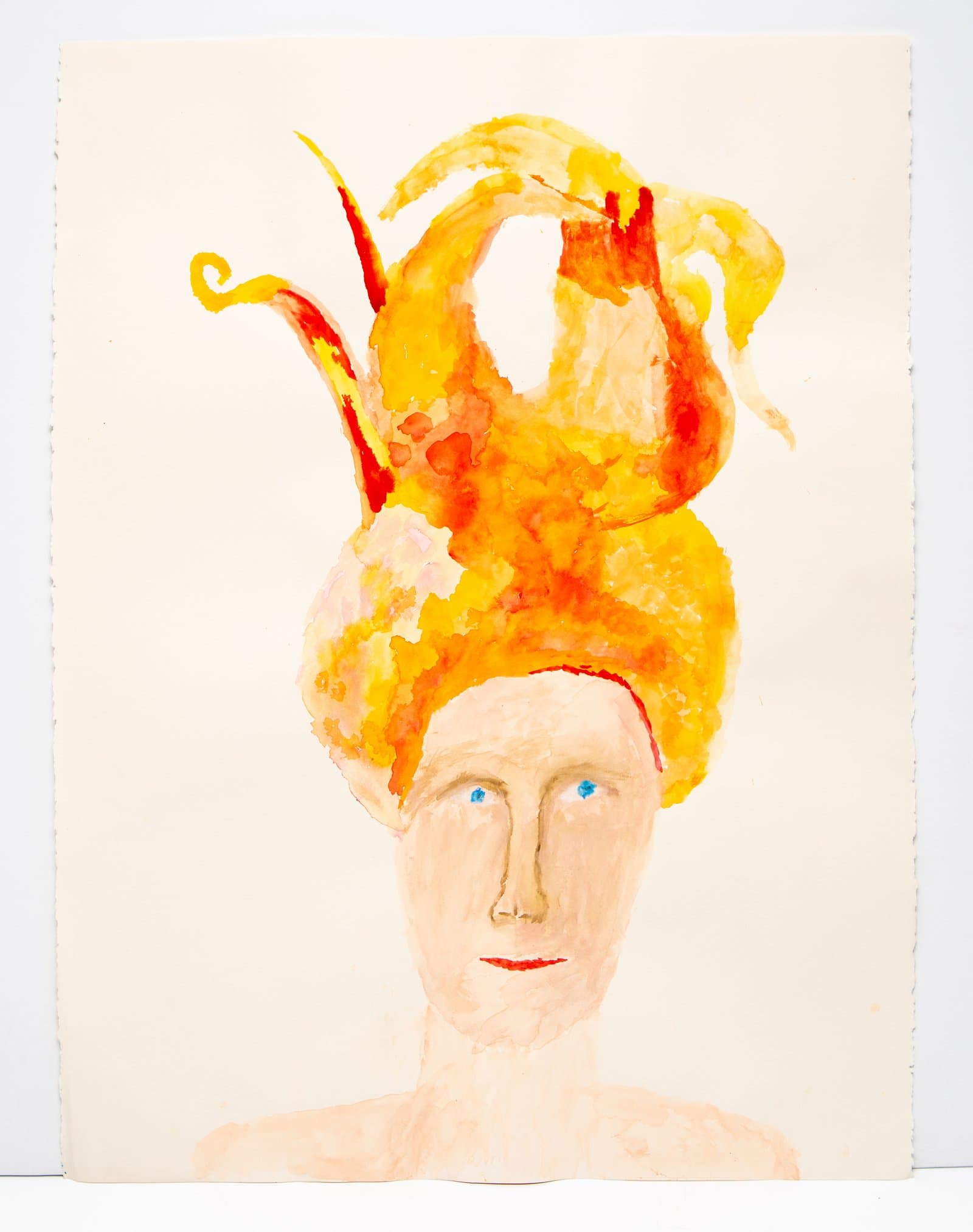 Watercolor portrait of a pale figure with blue eyes and red lips topped by an elaborate swirling orange and yellow headdress.