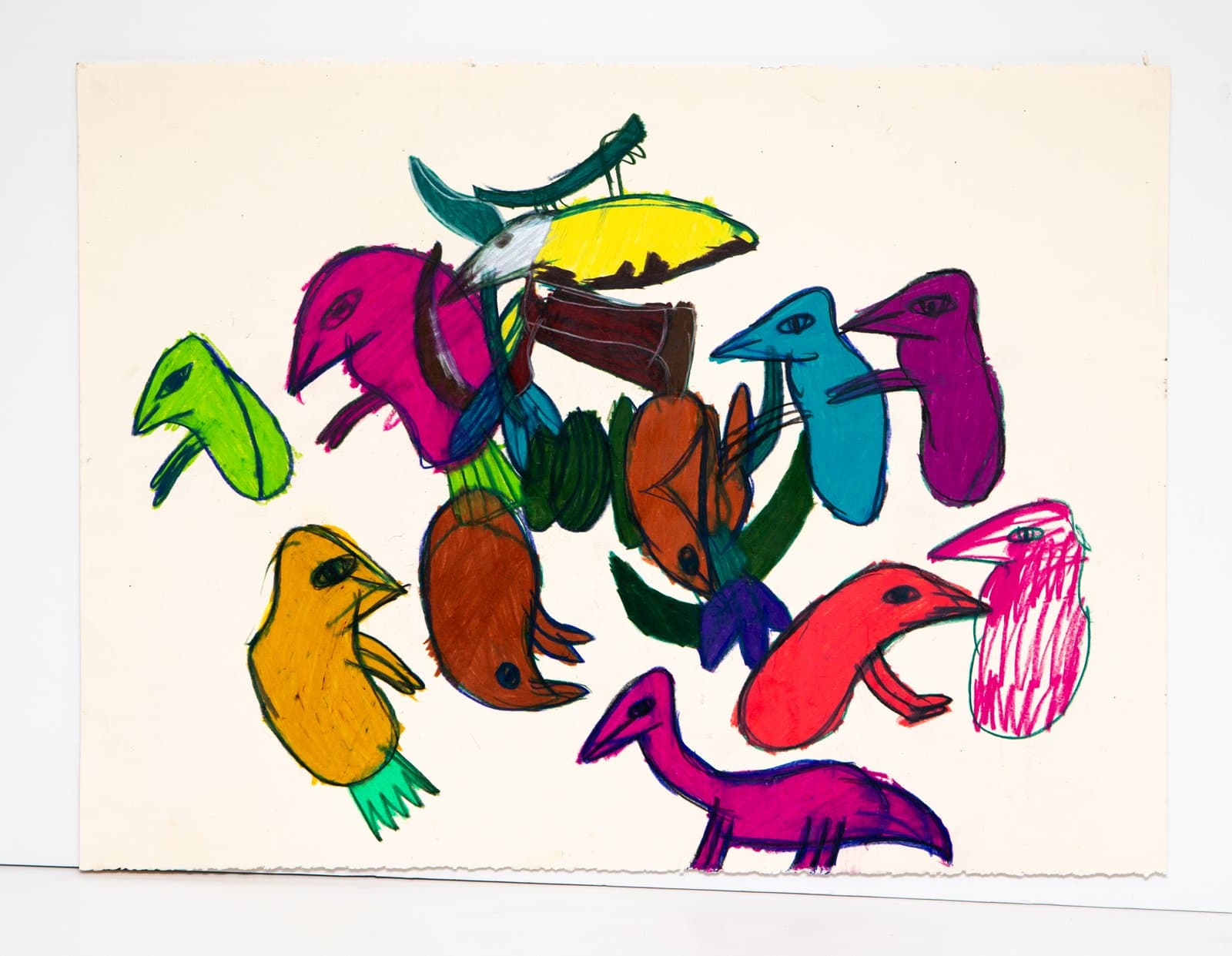 Drawing of many colorful birds clustered together in marker on cream paper, rendered in bright magenta, teal, orange, yellow, and green.