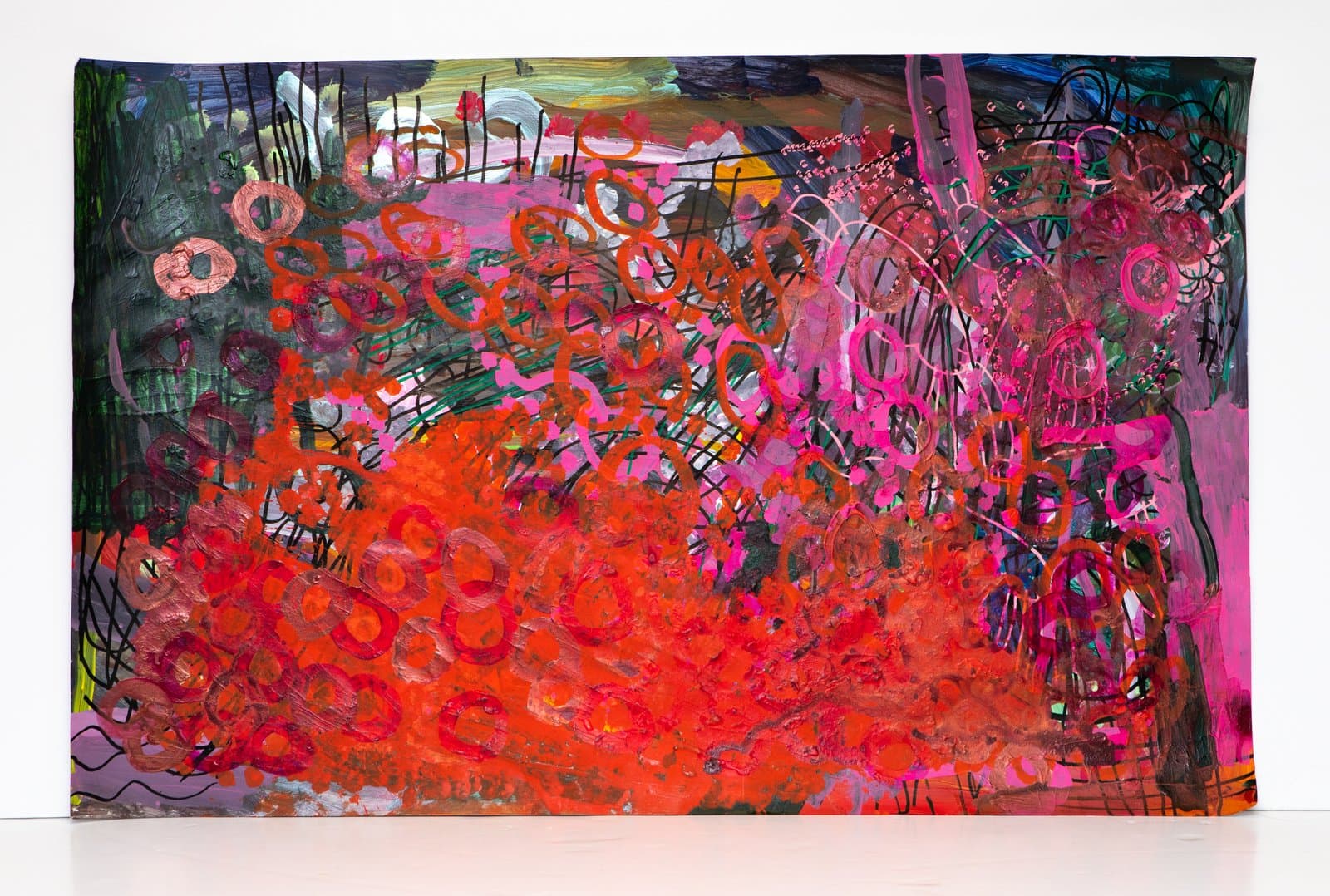 Large abstract painting in acrylic and pen with dense looping forms in red, orange, and pink on a dark ground.