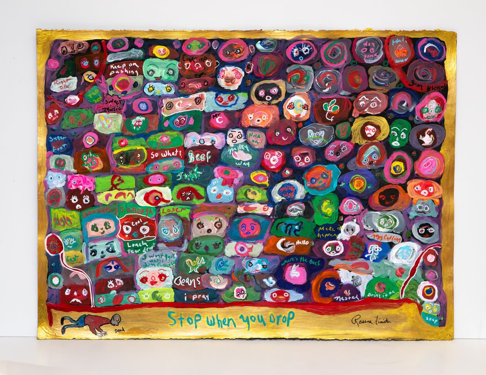 Dense acrylic painting on paper covered in colorful cartoon faces and handwritten phrases, with a gold border.