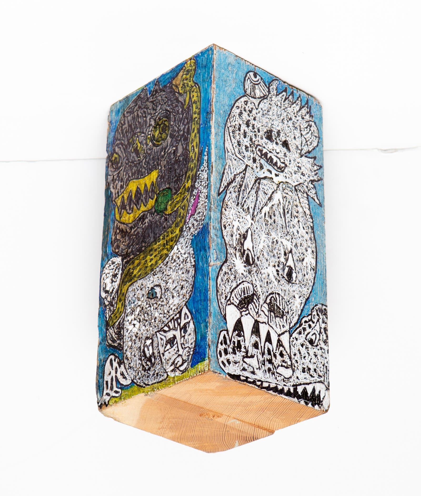 Acrylic on a small wooden block with two fantastical monster figures on bright blue backgrounds, one dark and one white.