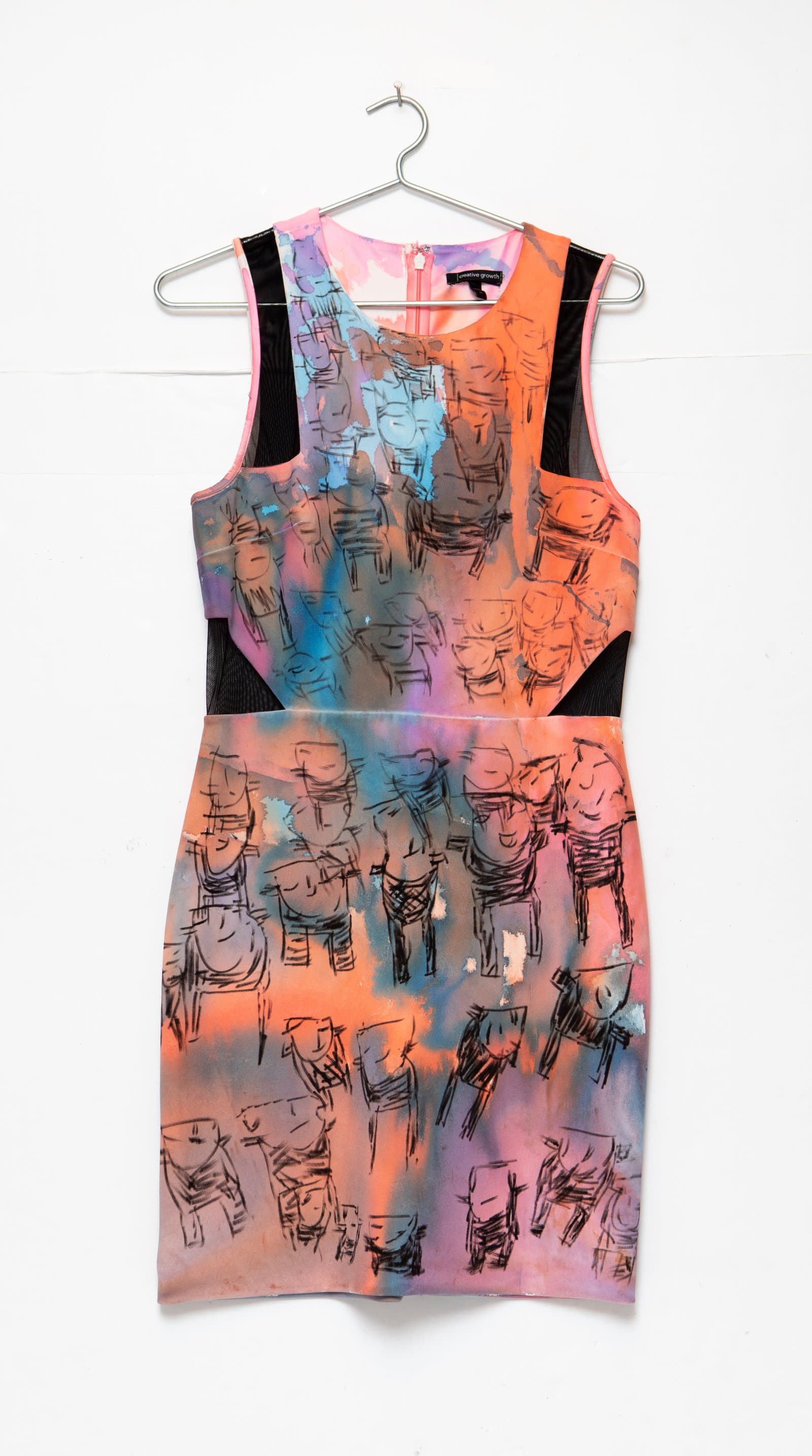 Sleeveless dress on hanger with hand-drawn black ink figures over watercolor washes in orange, pink, blue, and purple.