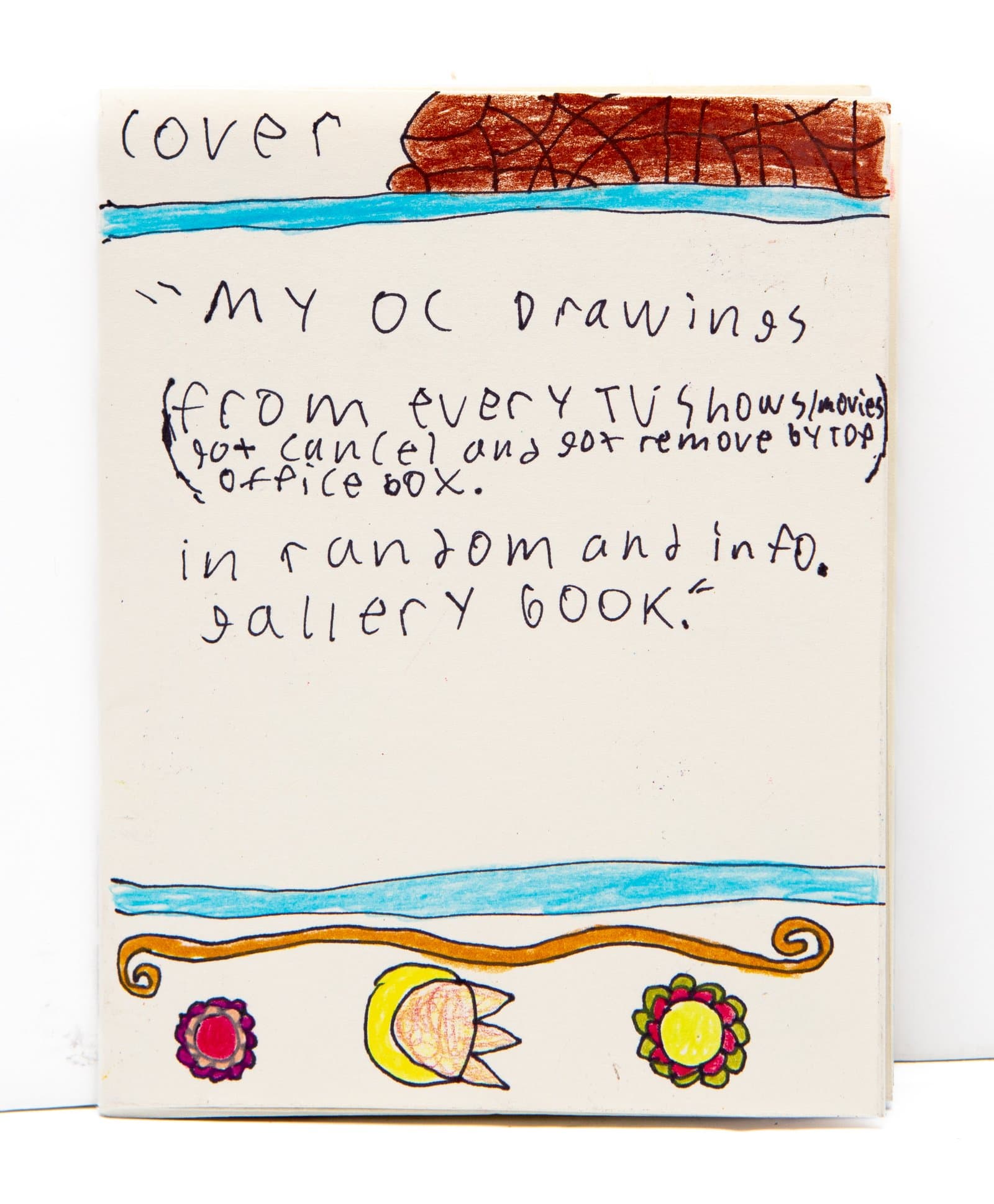 Handmade book cover with handwritten text, marker drawings of flowers and a tulip at bottom, and a brown rocky form at top.