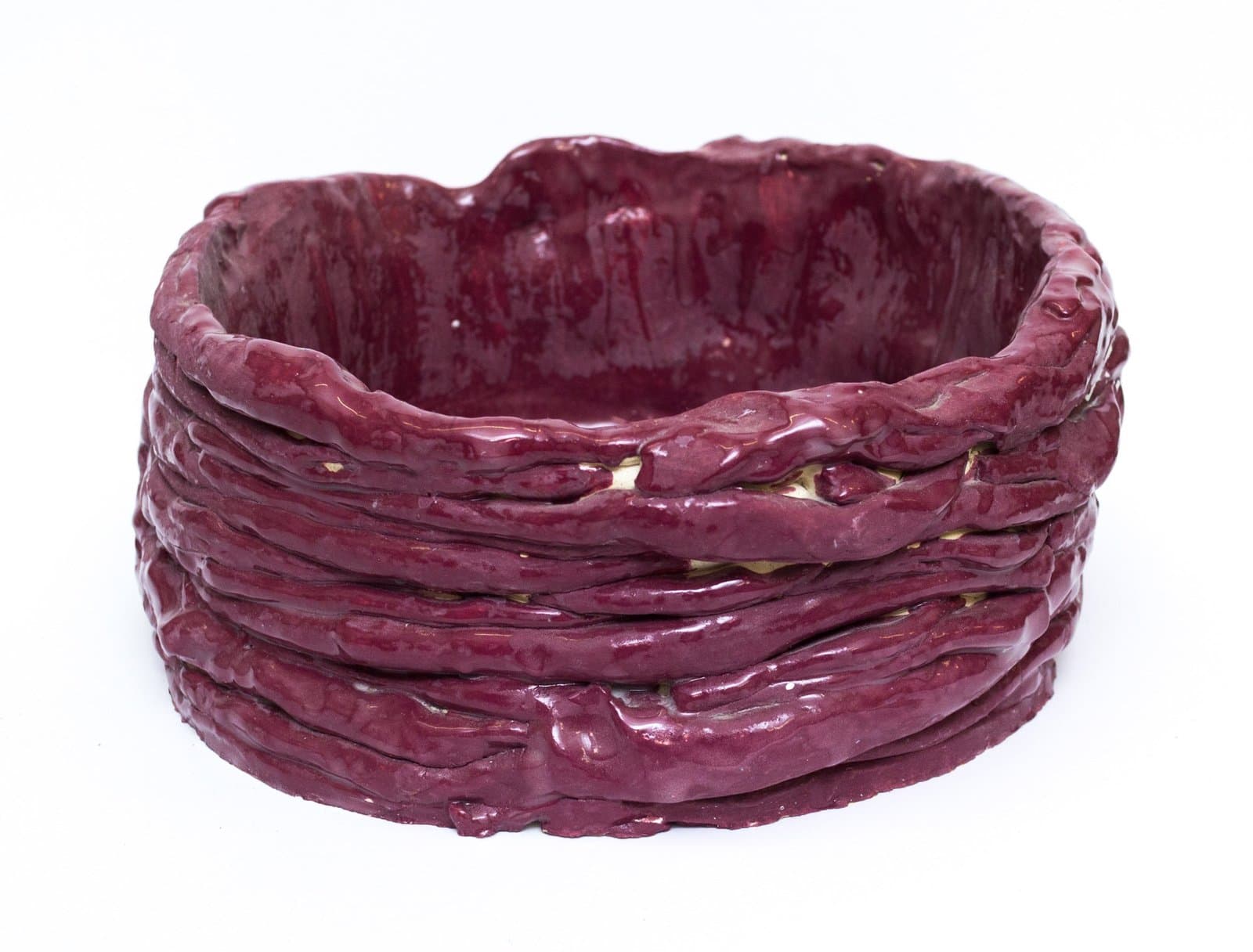 Ceramic bowl with coiled rope-like texture in deep burgundy glaze