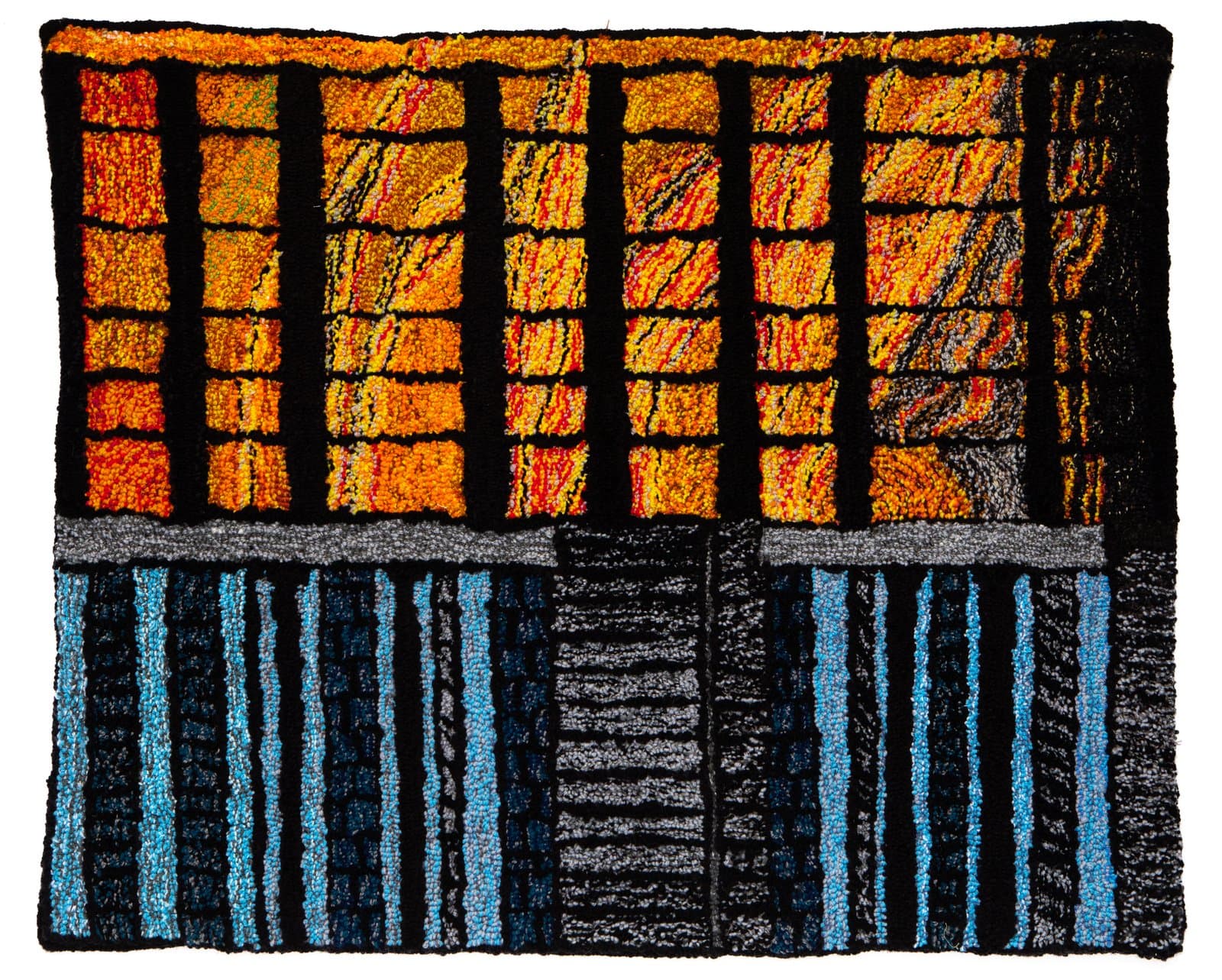Tufted rug divided into two horizontal sections: warm orange and black grid above, cool blue and black vertical stripes below.