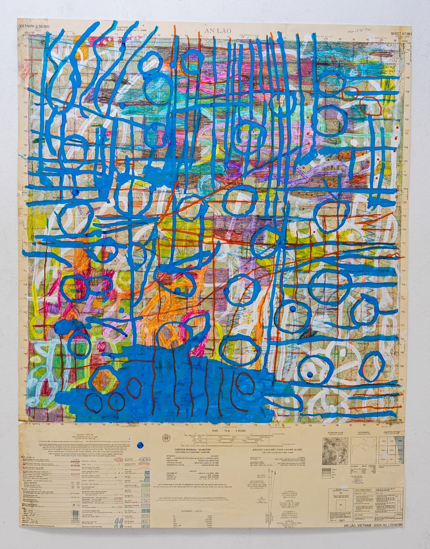 Mixed media artwork with blue linear patterns and circles overlaying a Vietnam map base in vibrant colors.