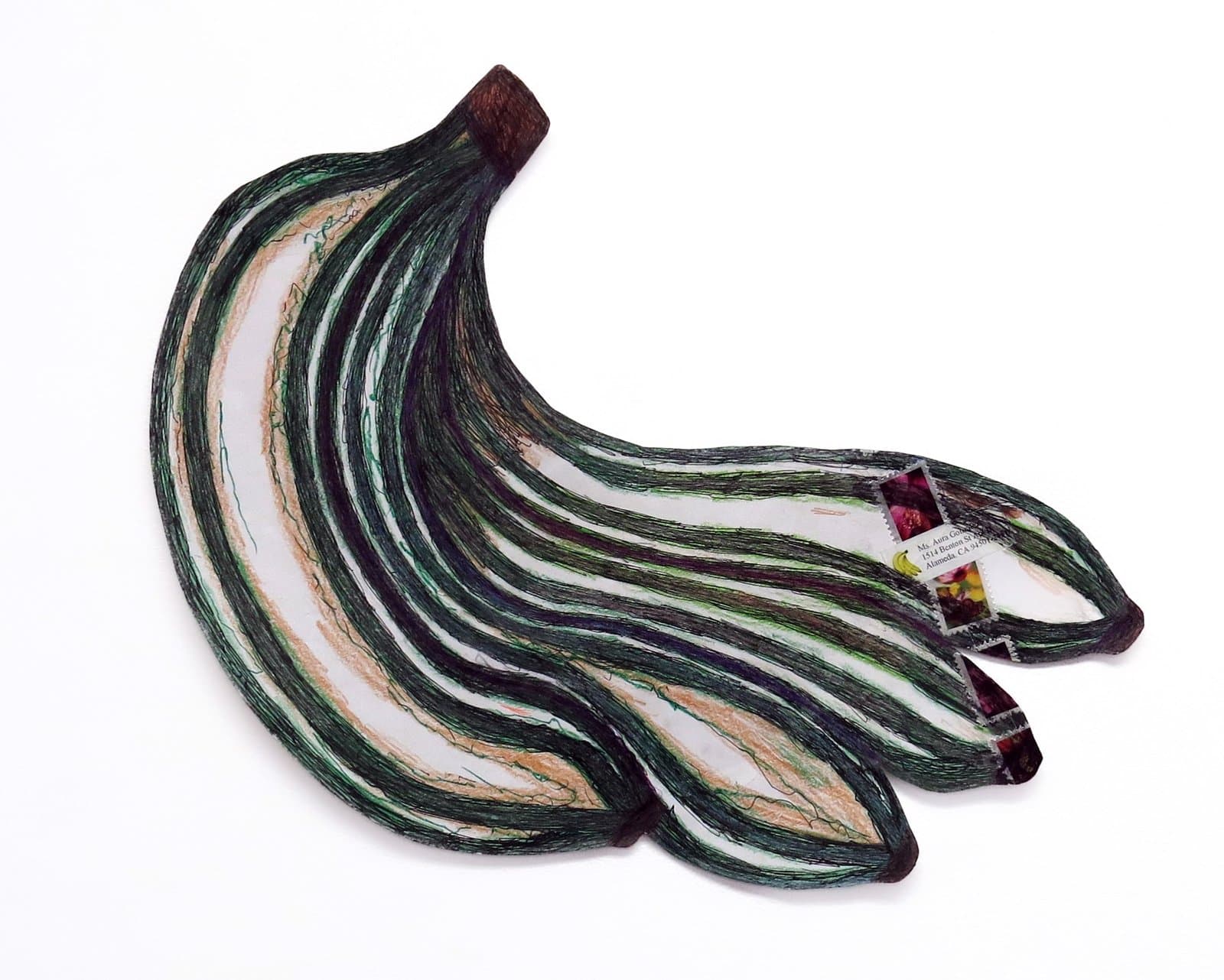 Mixed media sculpture of banana bunch with layered strips in green, white, and brown colors on white background