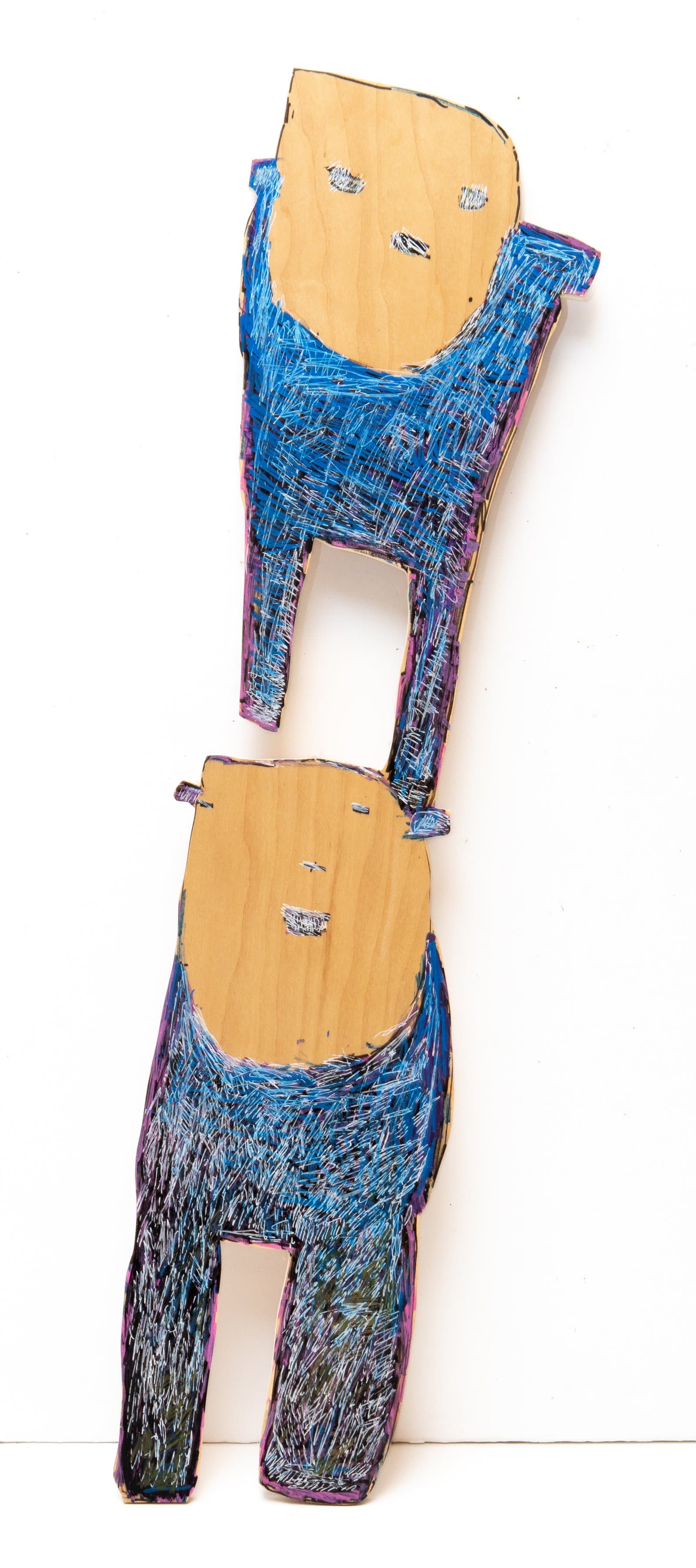 Two stacked figural wood cutouts painted with dense blue and black crosshatched acrylic and ink, with bare wood faces.