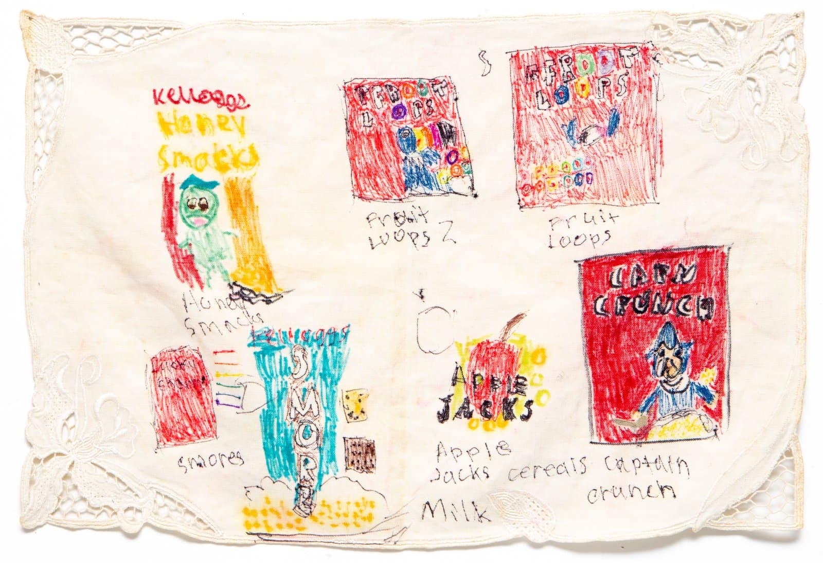 Marker drawings of cereal boxes including Honey Smacks, Fruit Loops, S'mores, Apple Jacks, and Cap'n Crunch on vintage linen with lace border.