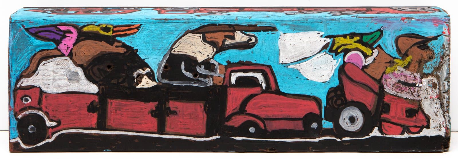 Acrylic painting on a narrow wood block depicting red trucks loaded with animals against a bright turquoise sky.