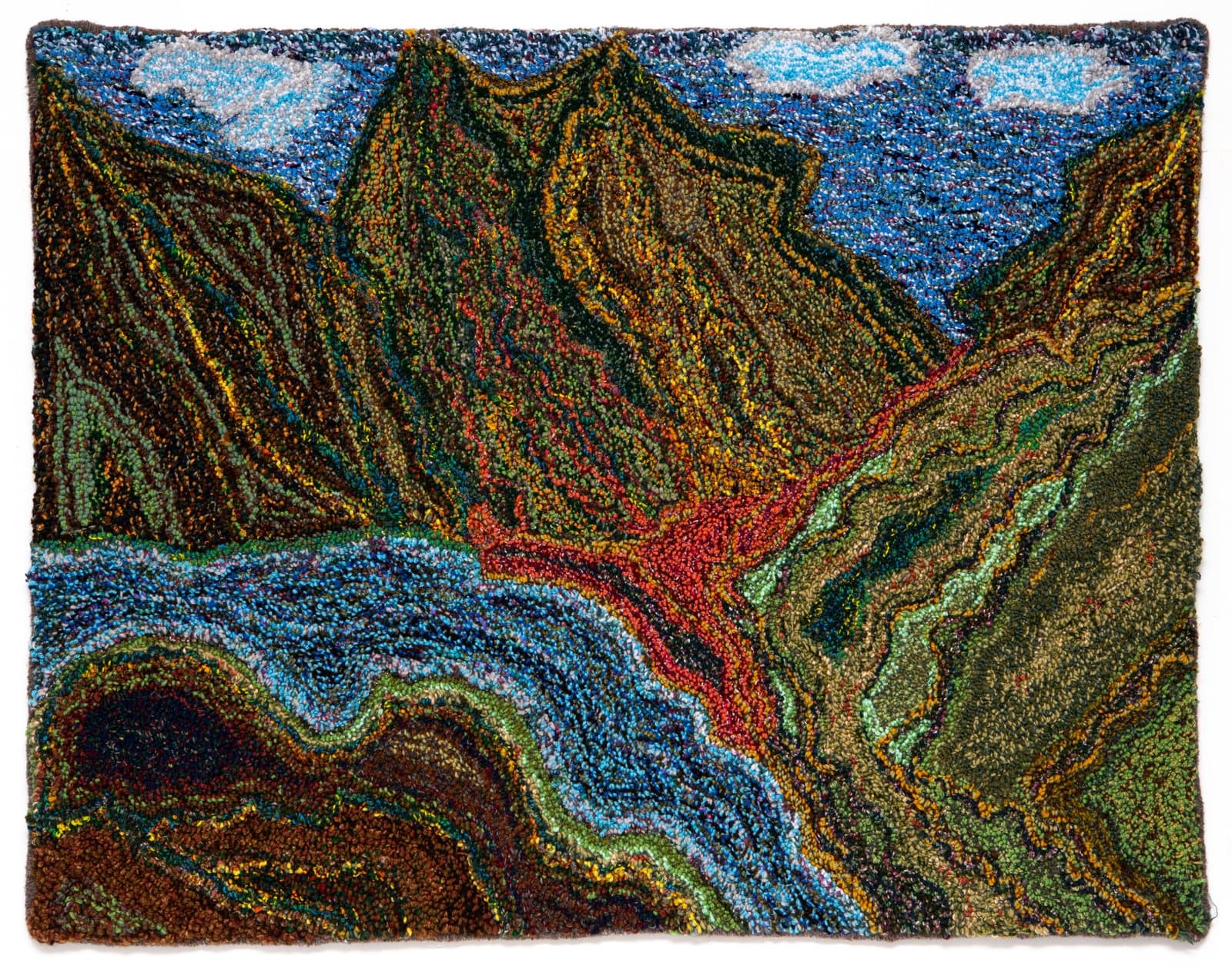 Hooked rug depicting a mountainous landscape with a river, in dark greens, browns, blue, and red-orange.