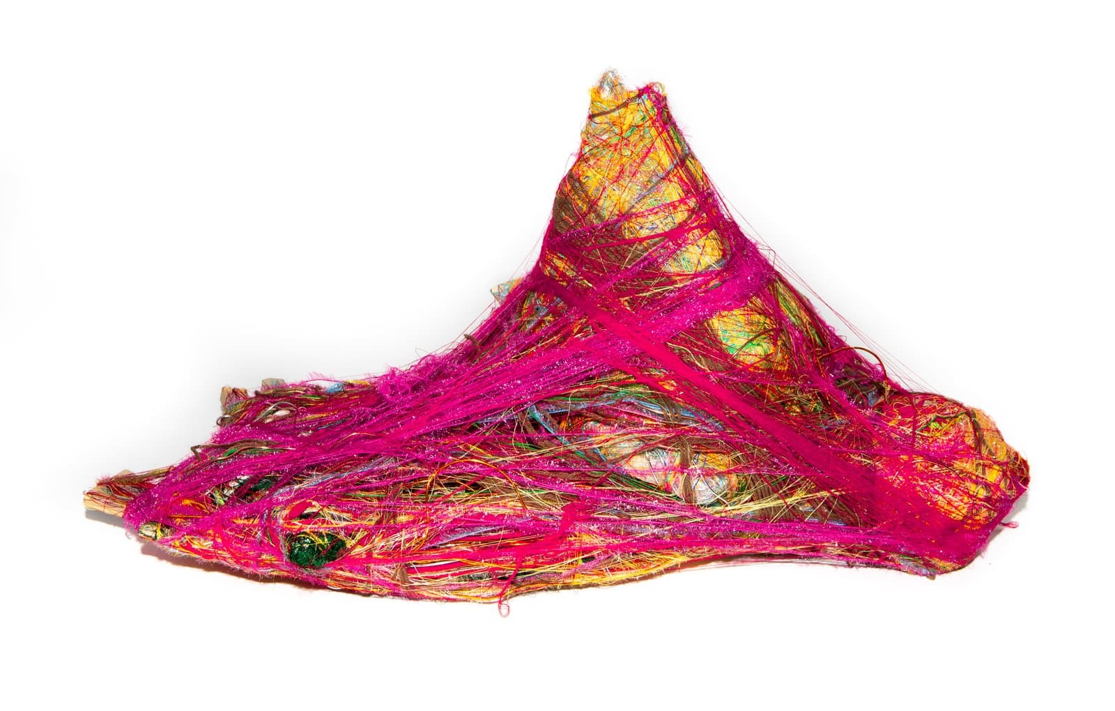 Fiber wrap sculpture with layered strands of magenta, yellow, green, and blue forming an irregular mounded shape.