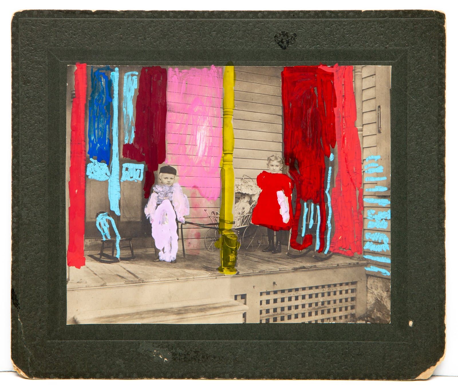 Vintage sepia cabinet photo of two children on a porch, altered with gestural acrylic paint strokes in red, pink, blue, cyan, and yellow.