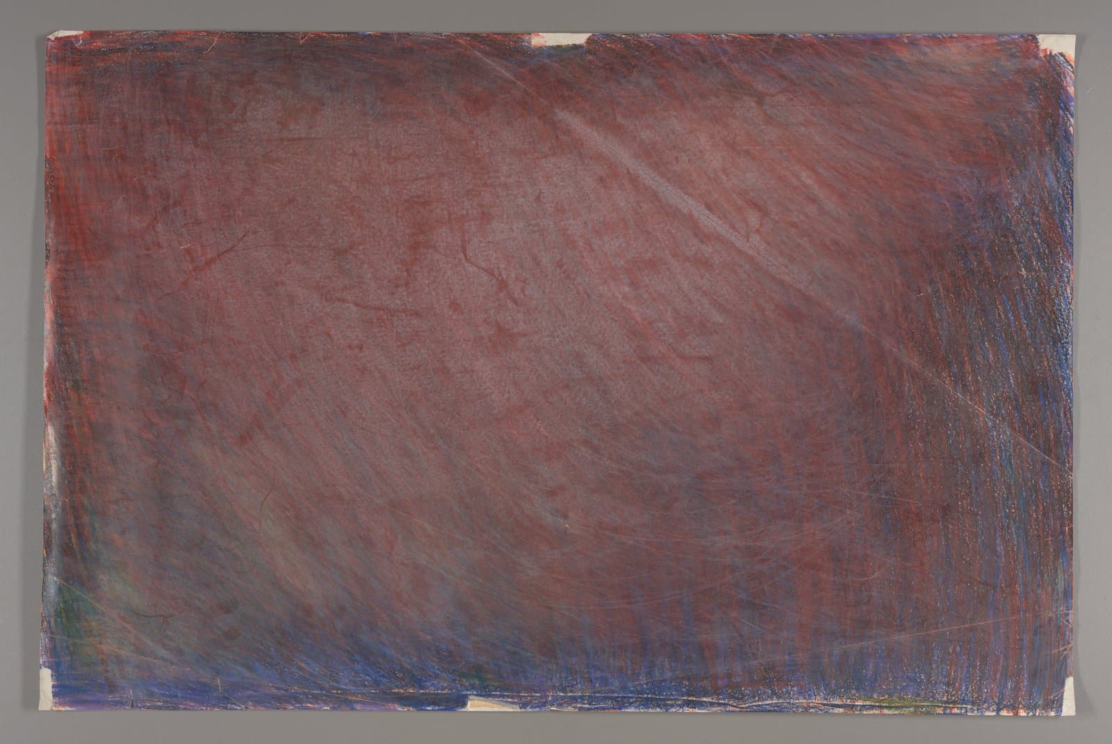 Abstract drawing with diagonal red and blue crayon strokes covering entire paper surface