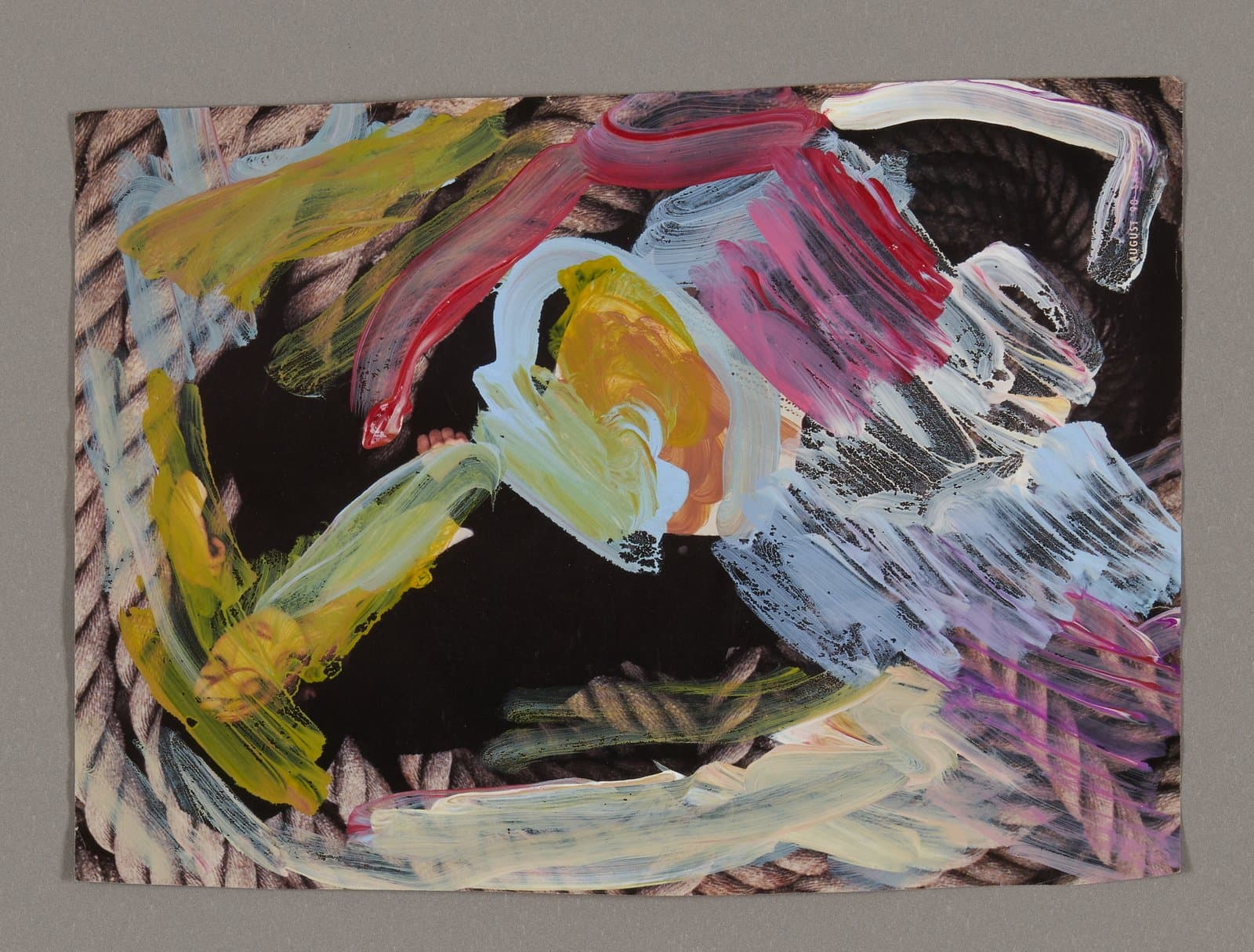 Abstract painting with bold brushstrokes in yellow, pink, white, and black on magazine pages