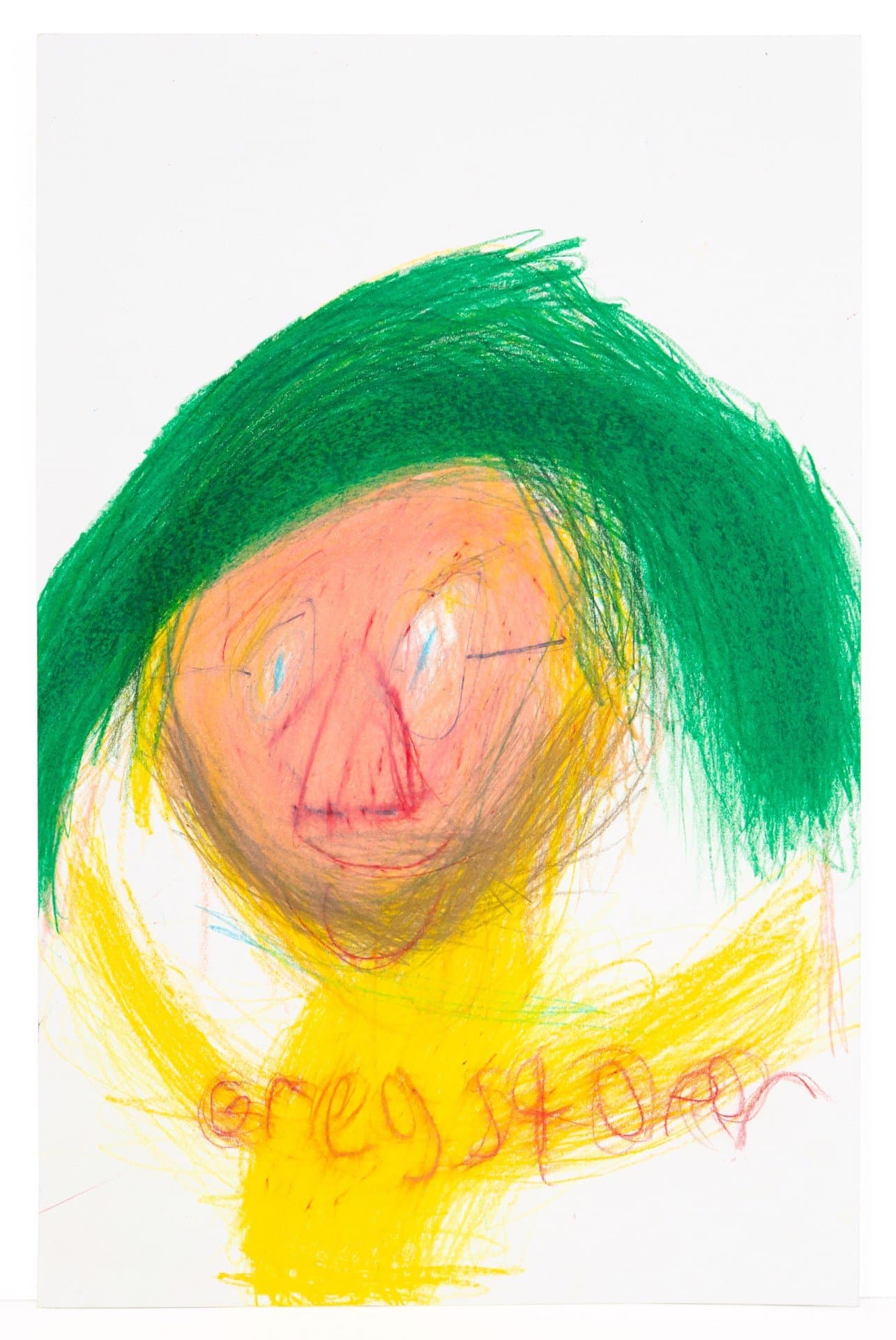 Expressive drawing in art stix showing a face with green hair and yellow clothing on white paper.