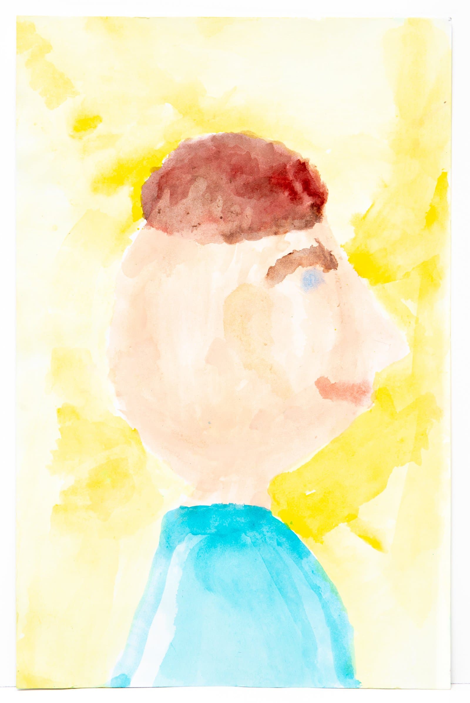 Watercolor portrait of a figure in three-quarter profile with brown hair and blue shirt against a yellow background.