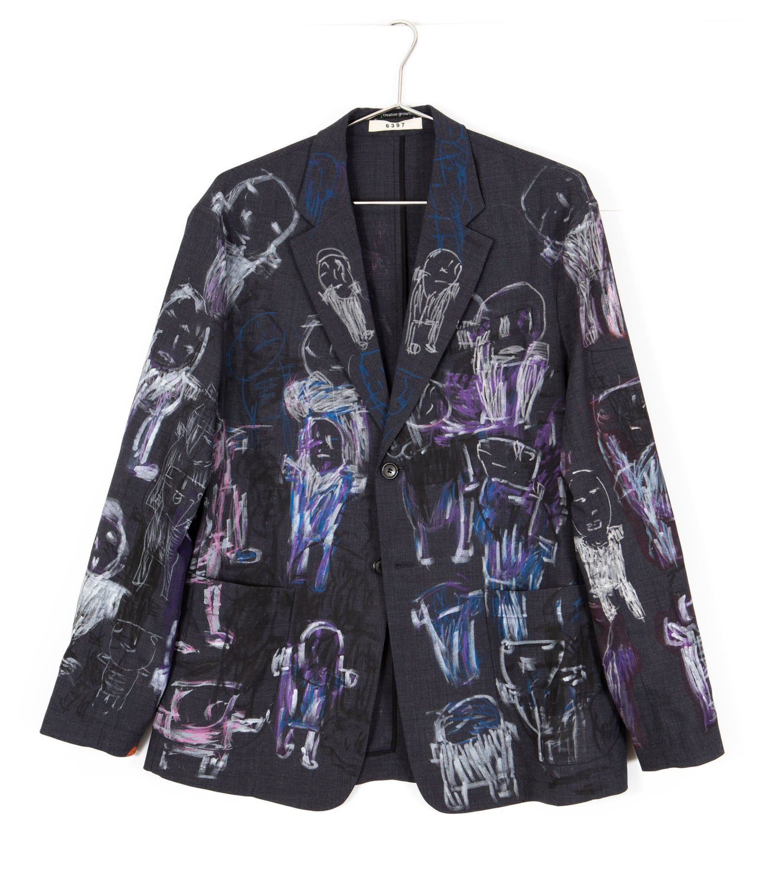 Dark navy blazer covered with hand-drawn figural forms in white, purple, pink, and blue paint or marker.