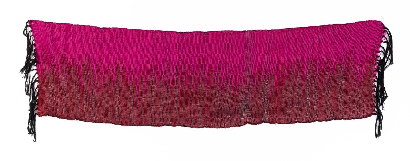 Rectangular woven textile in vivid magenta and deep red with black fringe along the bottom and sides.