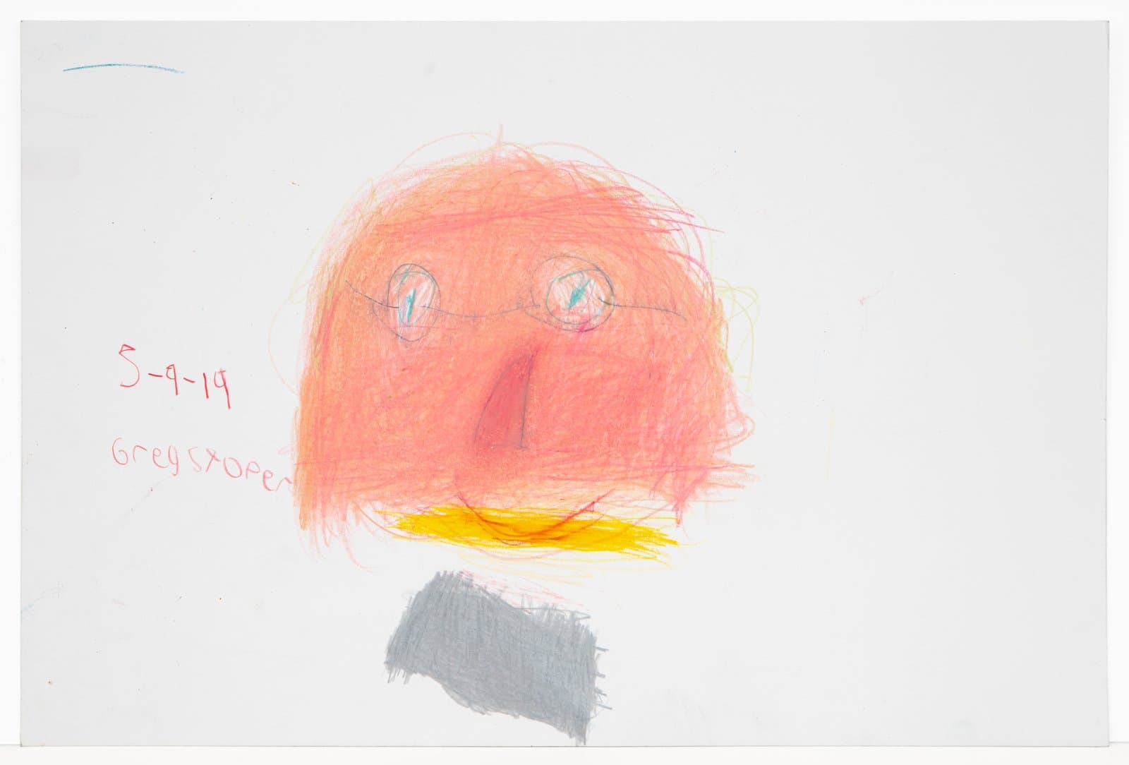 Colored pencil drawing of a face with orange-red scribbled features, yellow mouth, and gray rectangle below on white paper.