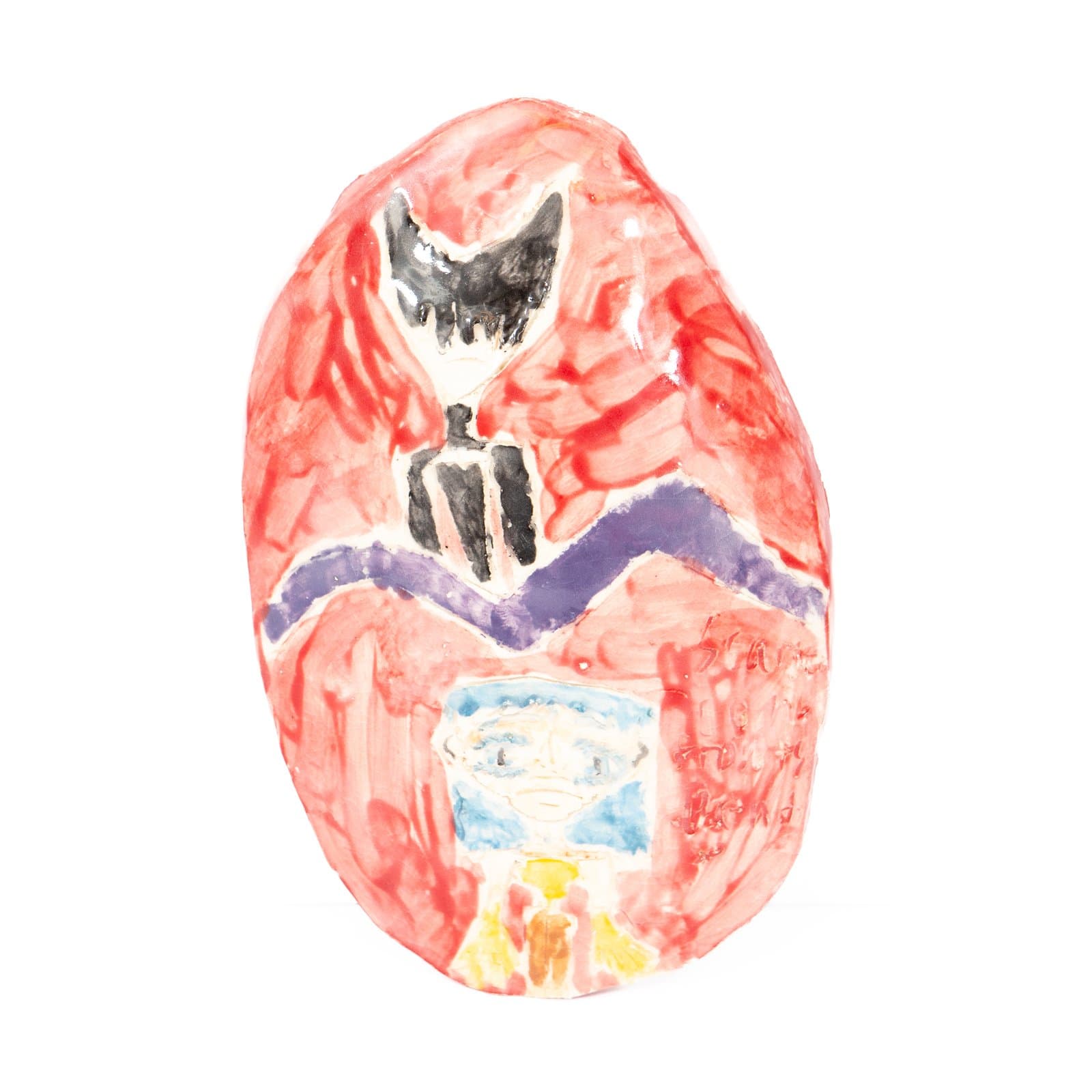 Egg-shaped ceramic piece painted with a red background, black winged figure, purple zigzag band, and small face in blue and yellow.