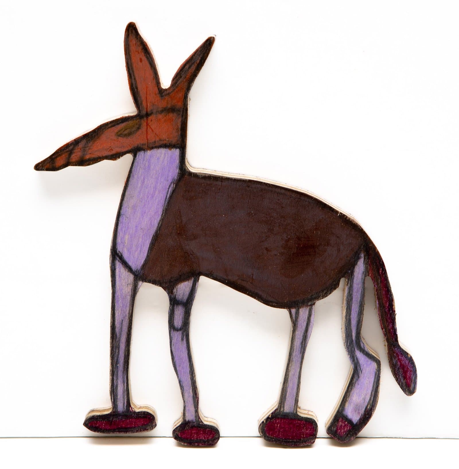 Wood cutout sculpture of a donkey in profile, colored with pastel in brown, purple, and red tones.