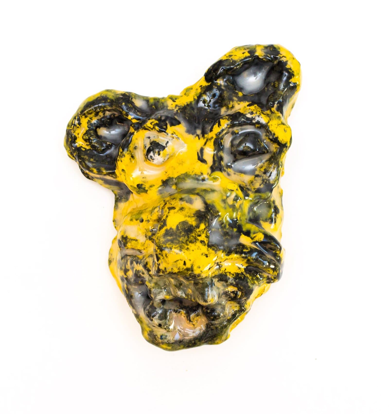Abstract sculptural form in bright yellow and dark gray with glossy, organic surface textures