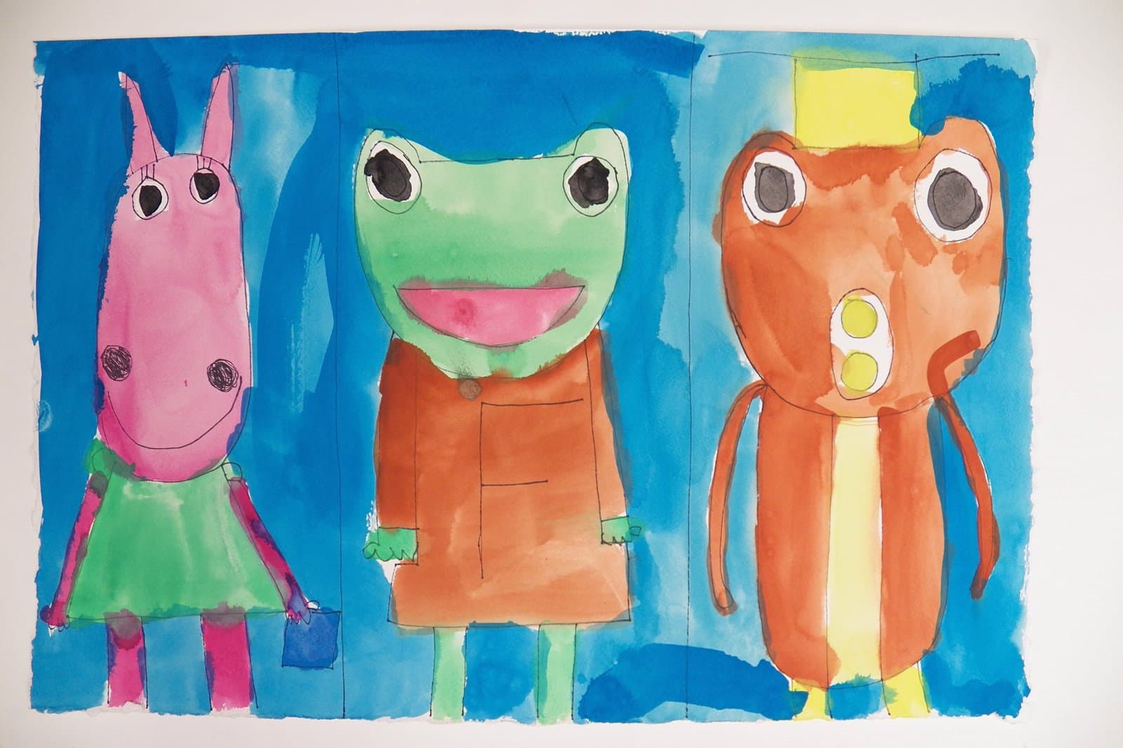 Watercolor painting of three colorful anthropomorphic animals - pink horse, green frog, and orange creature on blue background