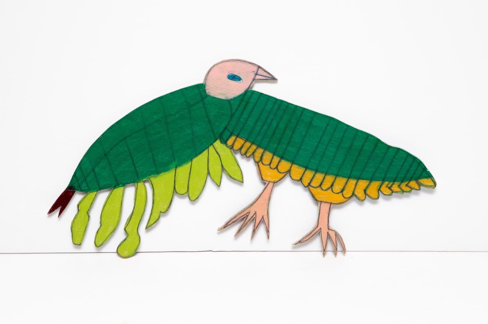 Mixed media bird sculpture with spread wings in green, yellow, and orange on white background