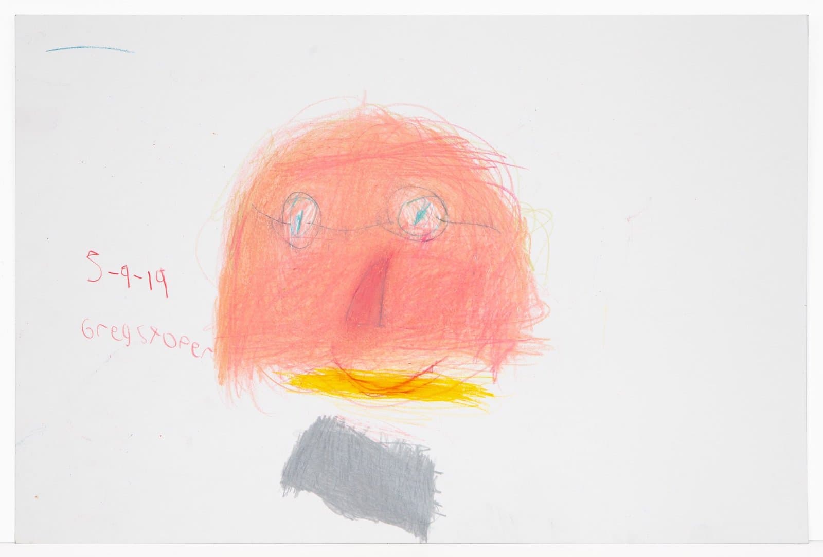 Child's drawing in colored pencil showing orange circular face with eyes, nose, yellow mouth area, and gray body on white paper