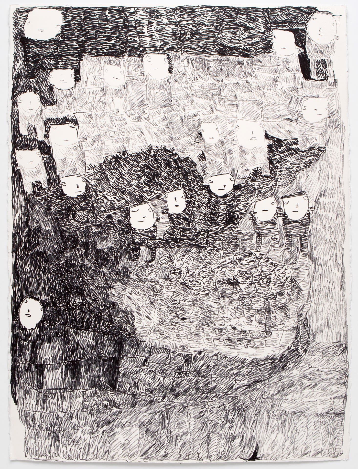 Black ink drawing on paper showing multiple simple face shapes scattered across densely hatched dark and light areas